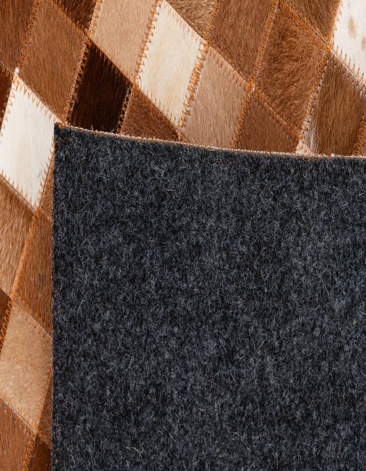 Detail image of  5' 1 x 7' 11 Cowhide Stocks Rug