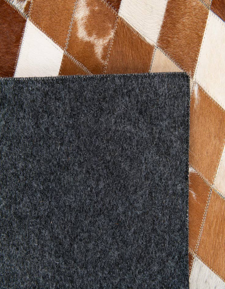 Detail image of  5' x 7' 11 Cowhide Stocks Rug