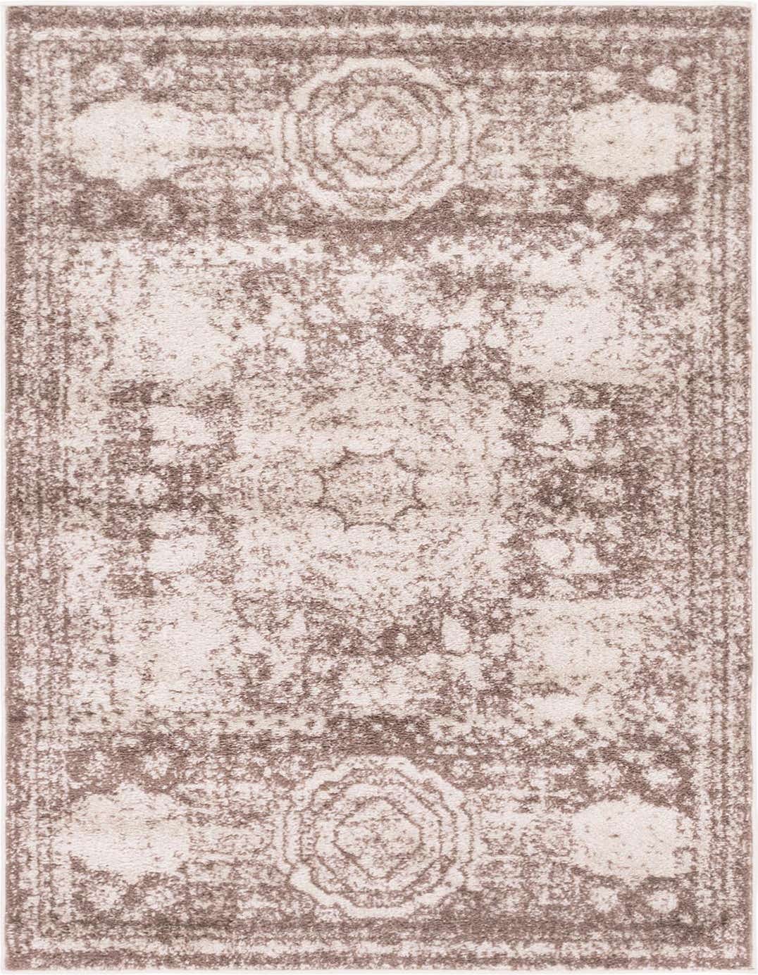 A 3x5 rectangular Dover Collection rug in shades of brown and tan, featuring a distressed medallion and bohemian pattern.