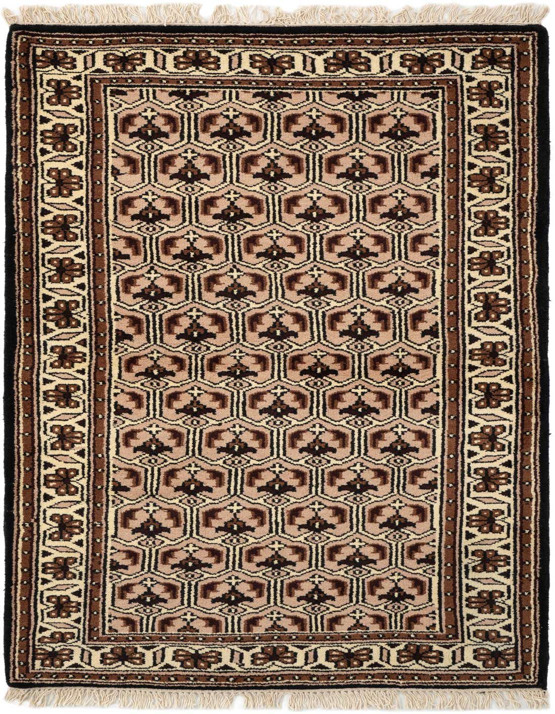 A 3x5 rectangular Ferdos tribal wool rug in browns and tans with a geometric pattern and fringed ends.