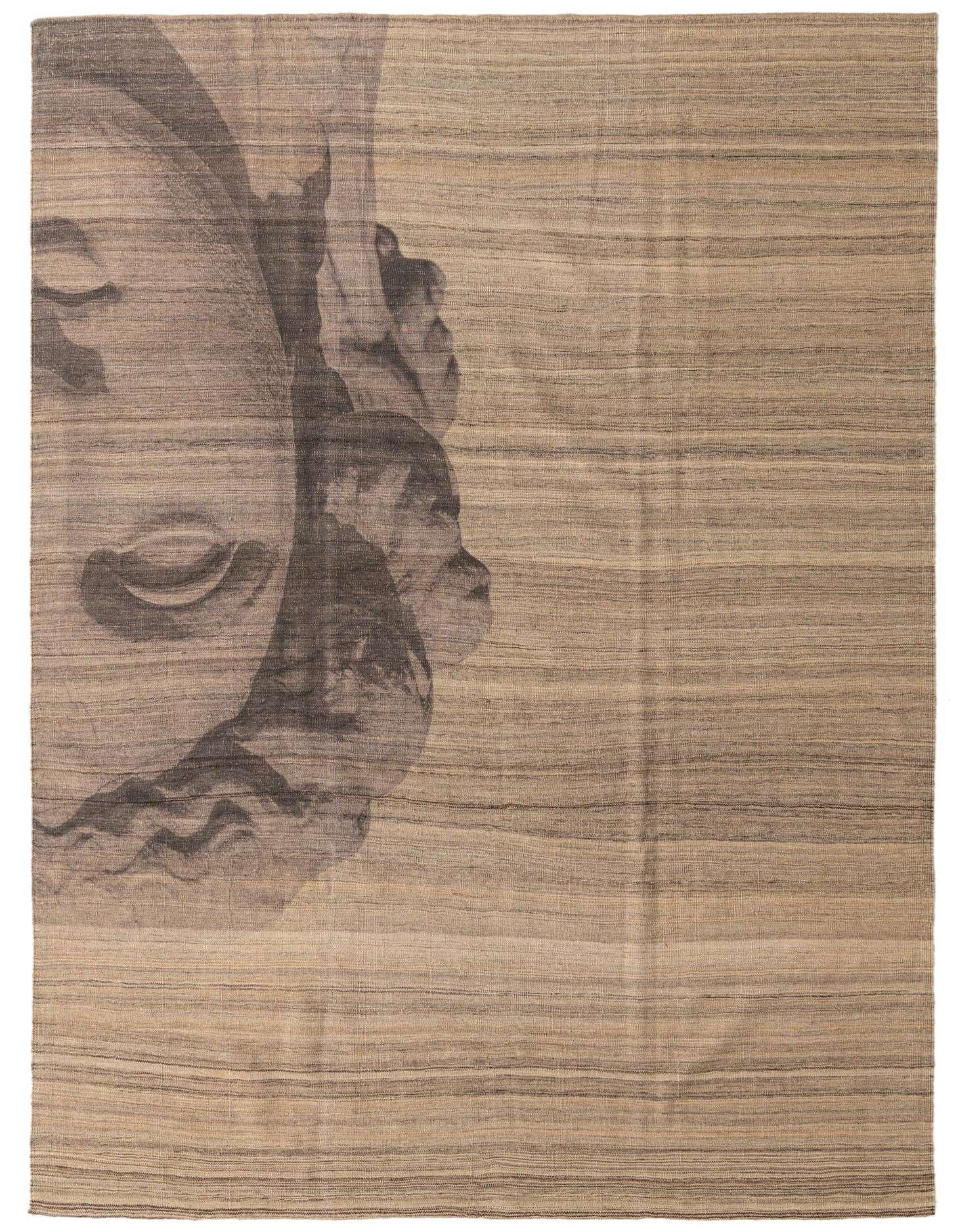 7x10 rectangular brown and tan flatweave wool rug with a large, abstract tribal face design on the left.