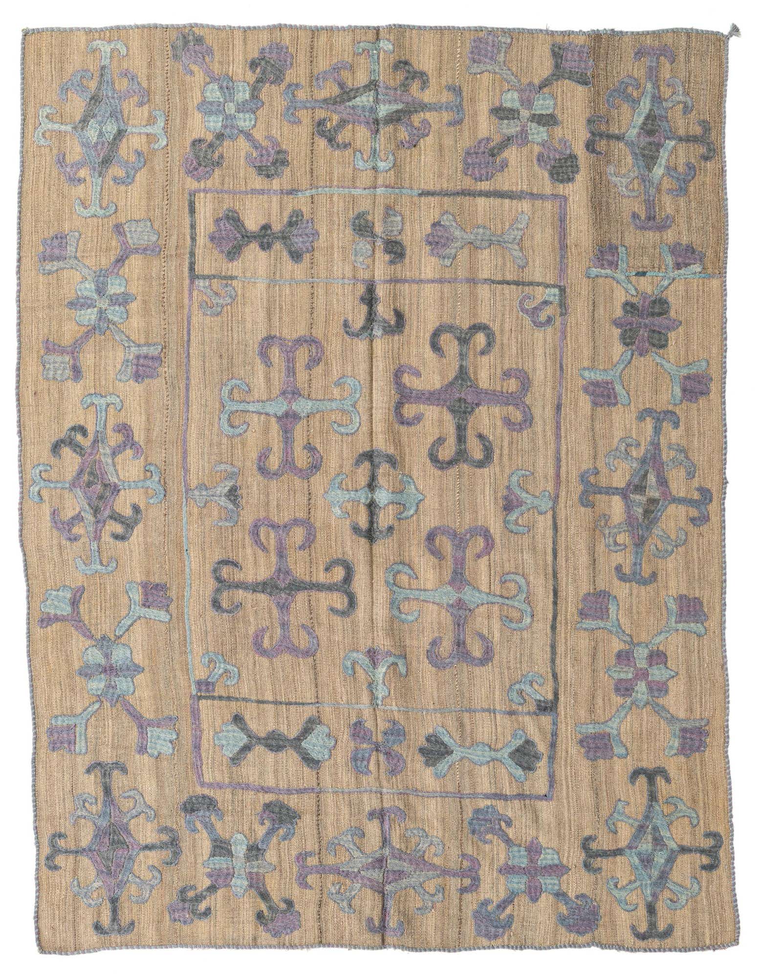 A 5x8 rectangular brown flatweave wool rug with a tribal Suzani pattern in shades of purple, blue, and grey.