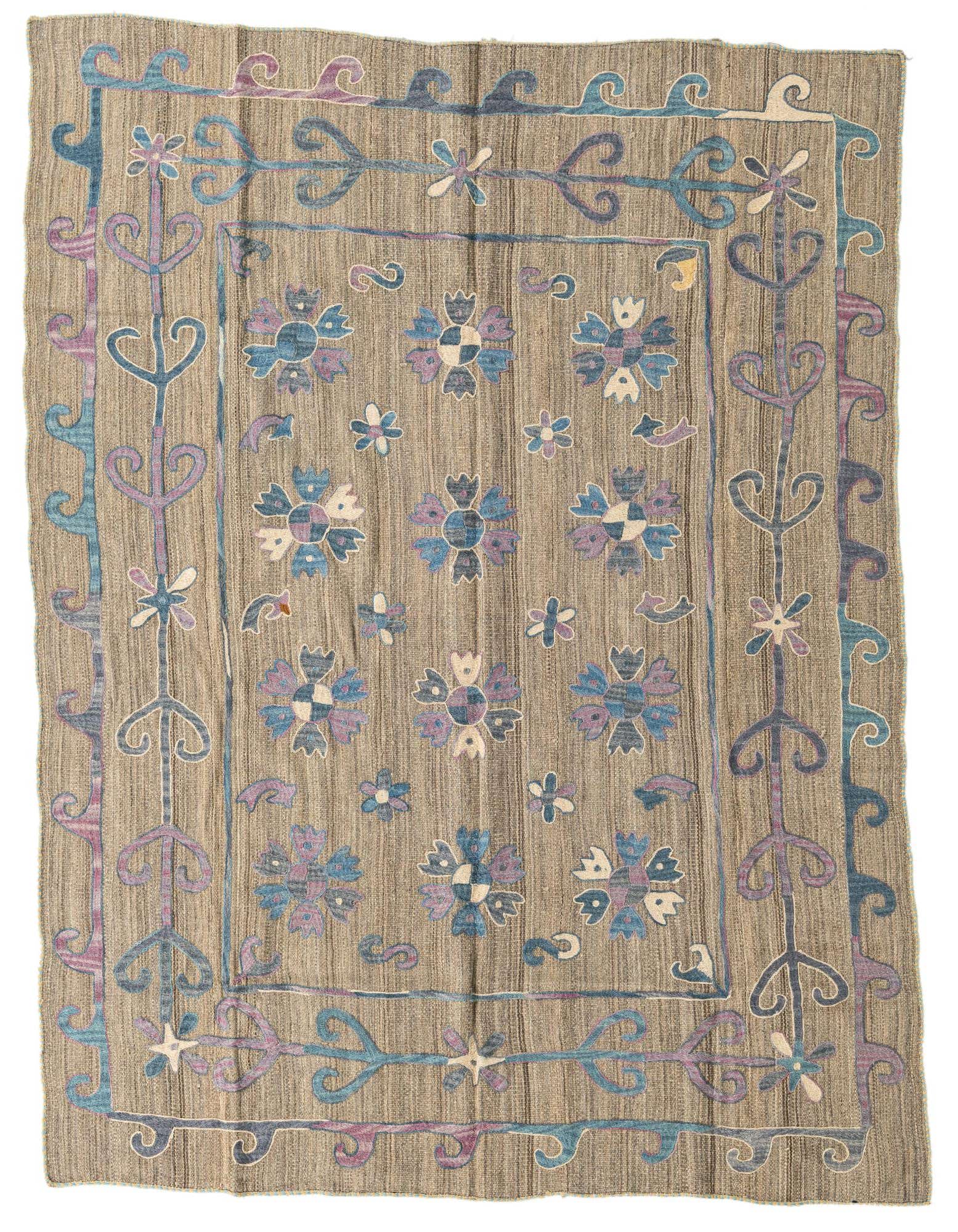 A 5x8 rectangular Kilim Suzani rug featuring a brown flatweave base with blue and purple tribal floral patterns and a decorative border.