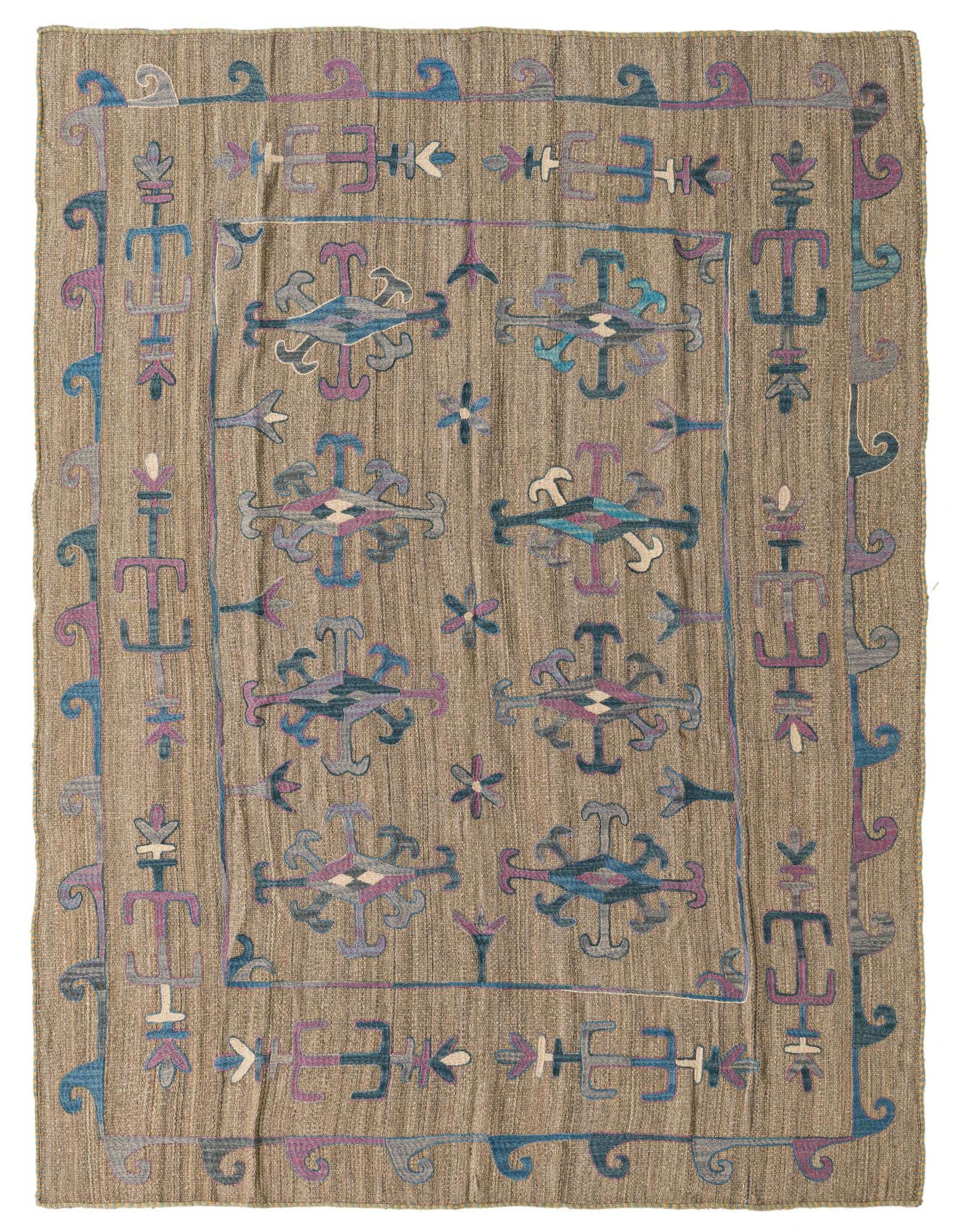 A 5x8 rectangular brown Kilim Suzani rug with a flatweave texture and colorful tribal patterns in blue, purple, and tan.