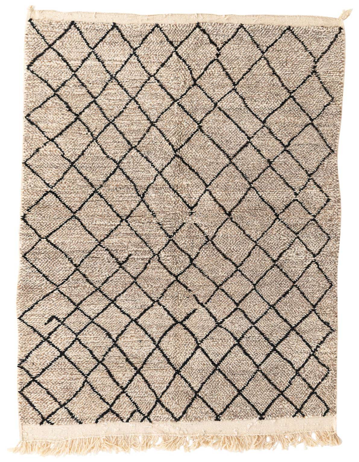 A 4x6 rectangular brown shag rug with a black tribal diamond pattern and fringed edges, suitable for a living room.