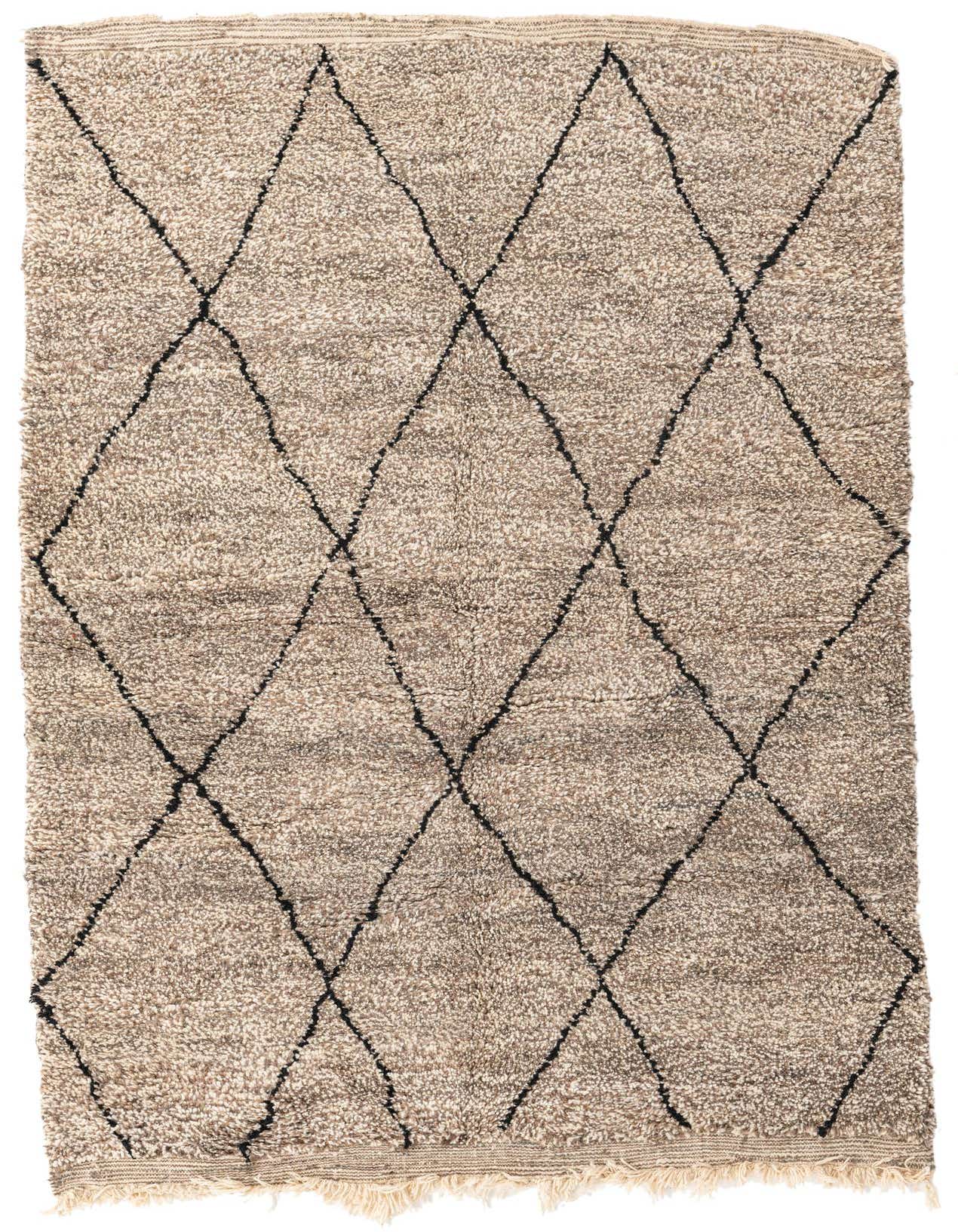 A 5x8 rectangular Moroccan shag rug in varying shades of brown and tan with a black tribal diamond pattern.