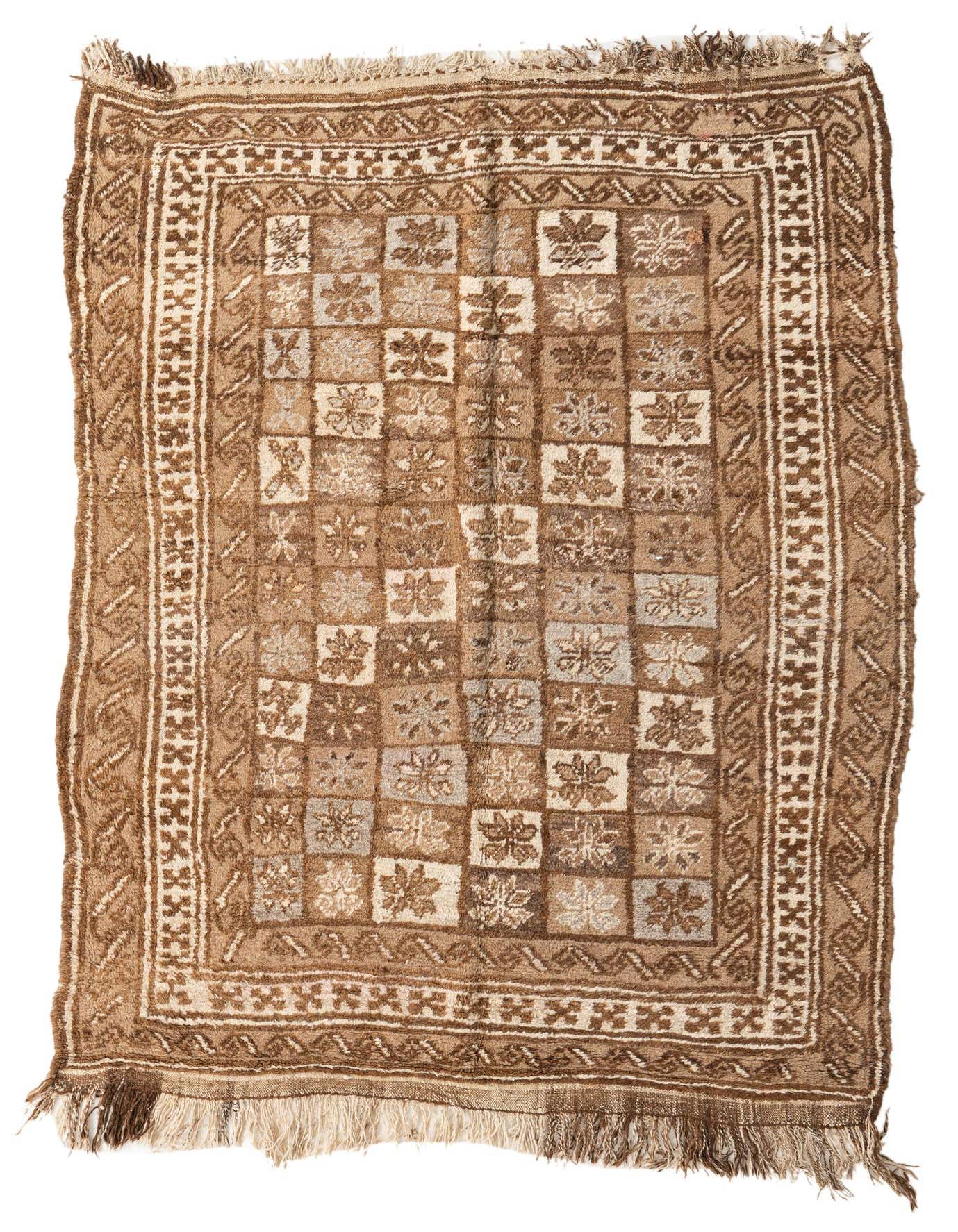 A 5x8 rectangular brown and tan wool shag rug with a tribal checkerboard pattern and fringed edges.