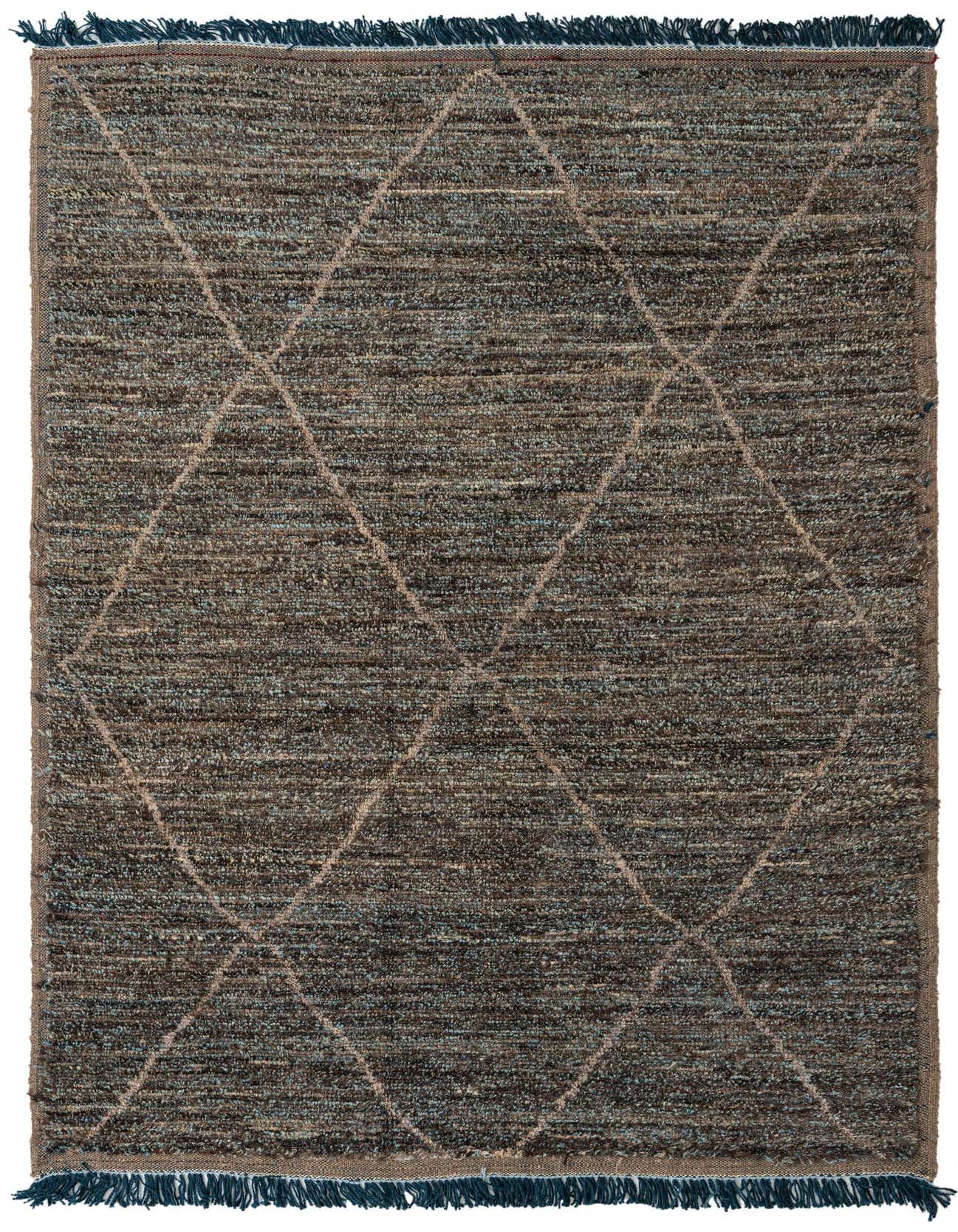 A 6x9 rectangular brown and tan wool shag rug with a modern tribal diamond pattern and dark blue fringes.