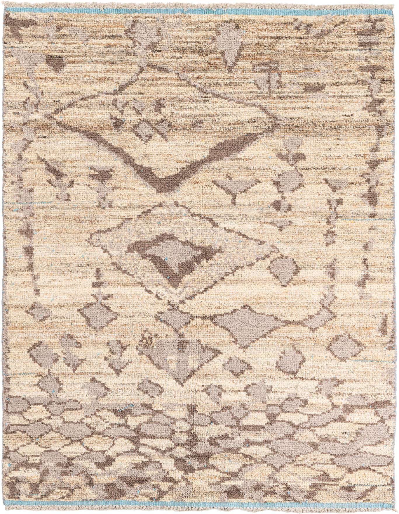 A 5x8 rectangular Moroccan shag rug in browns and tans with a tribal, abstract pattern, featuring light blue accents.