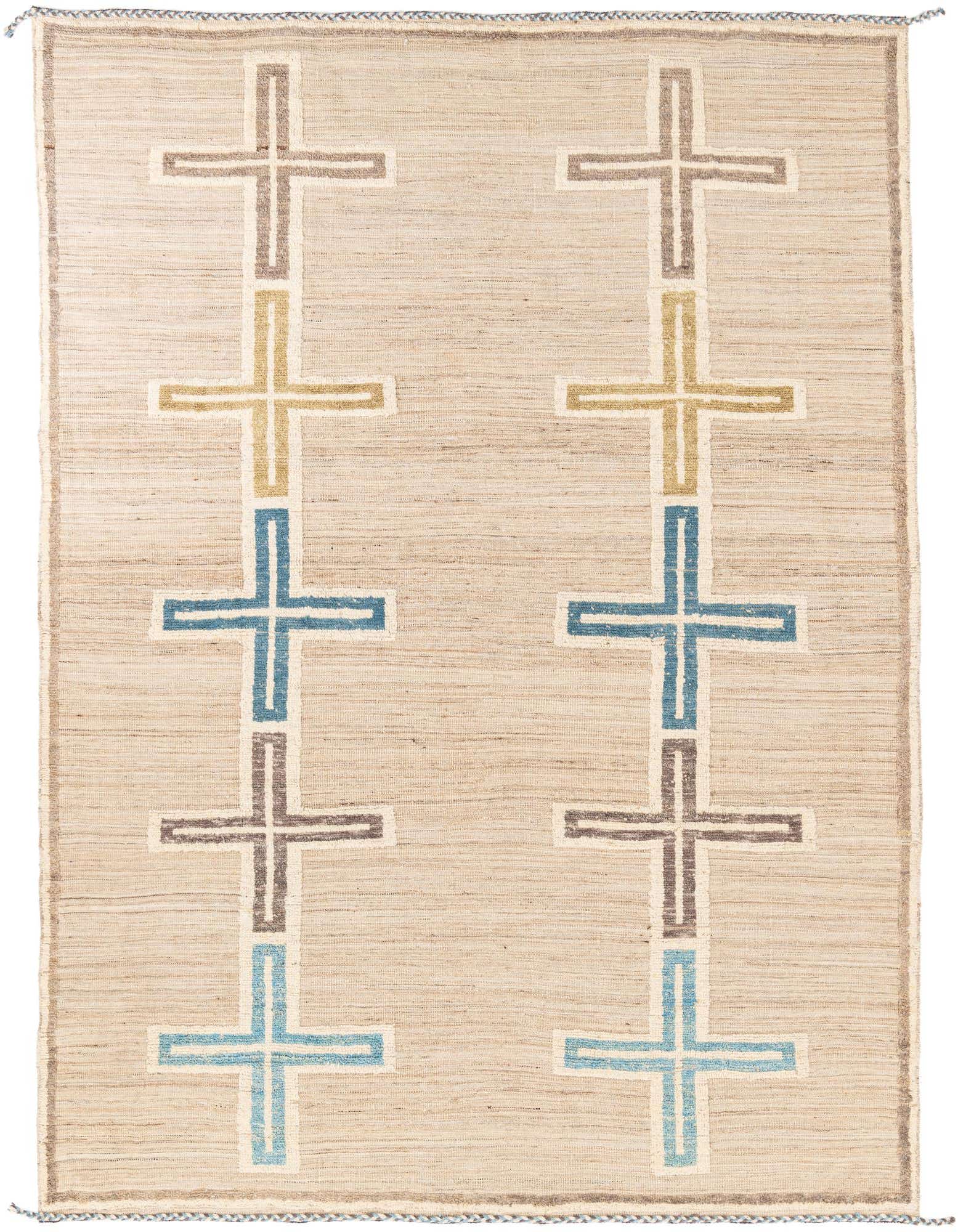 A rectangular 8x10 Moroccan shag rug with a tribal pattern of brown, tan, and blue crosses on a light beige background.