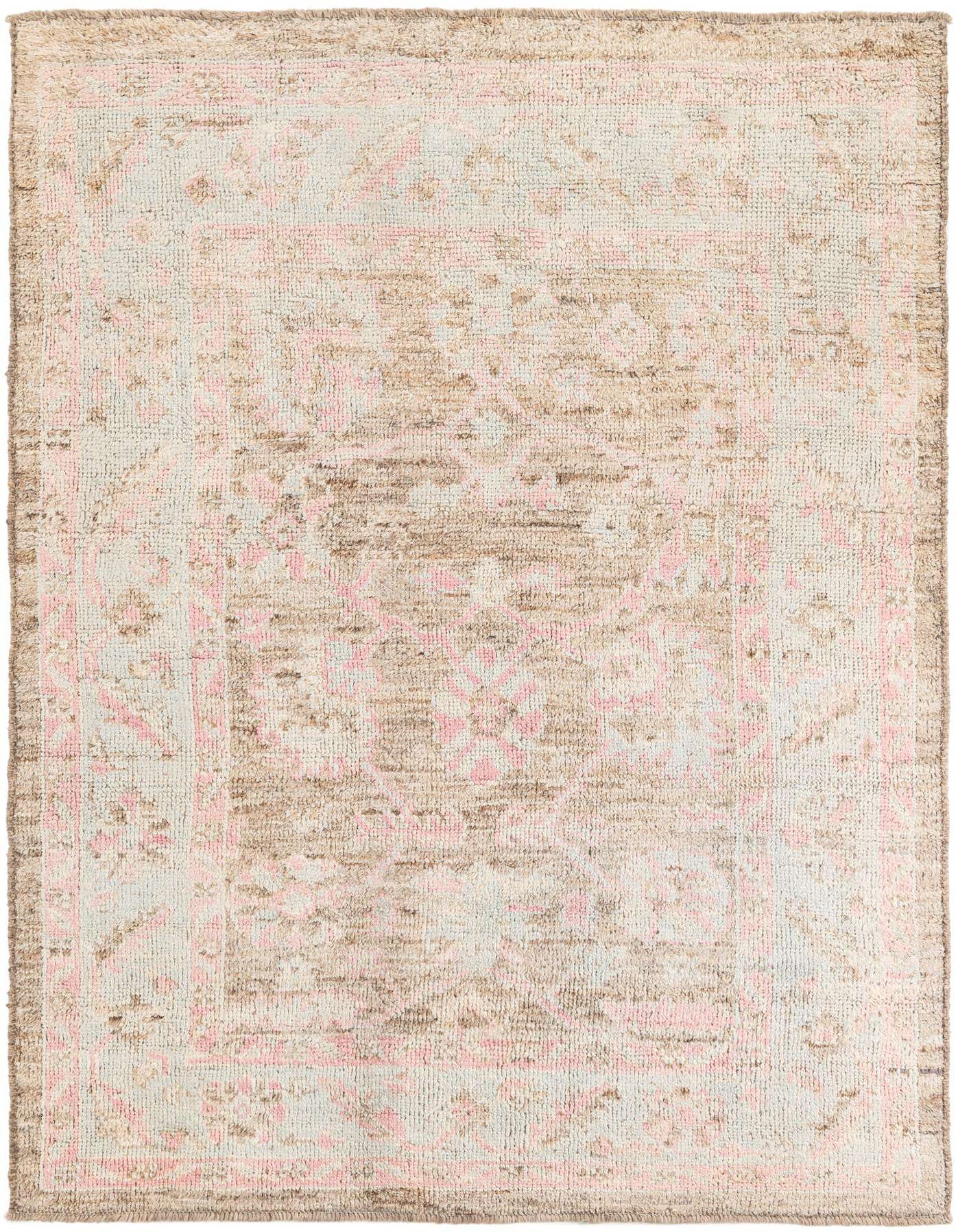 A rectangular 6x9 Moroccan shag rug in light brown and tan with subtle pink tribal patterns, ideal for a living room.