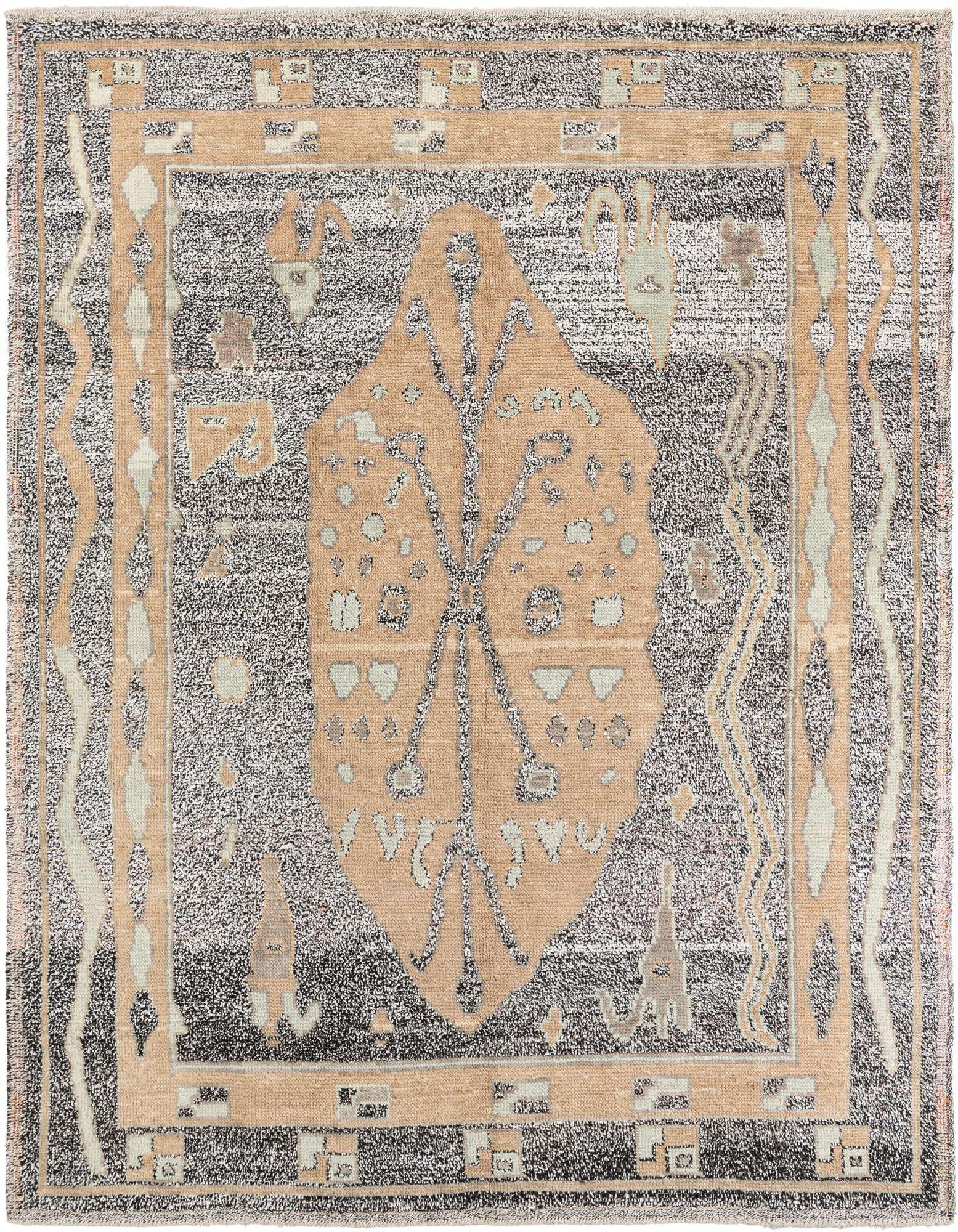 A rectangular 8x10 Moroccan shag rug with a tribal medallion pattern in browns, tans, and black, perfect for a living room.