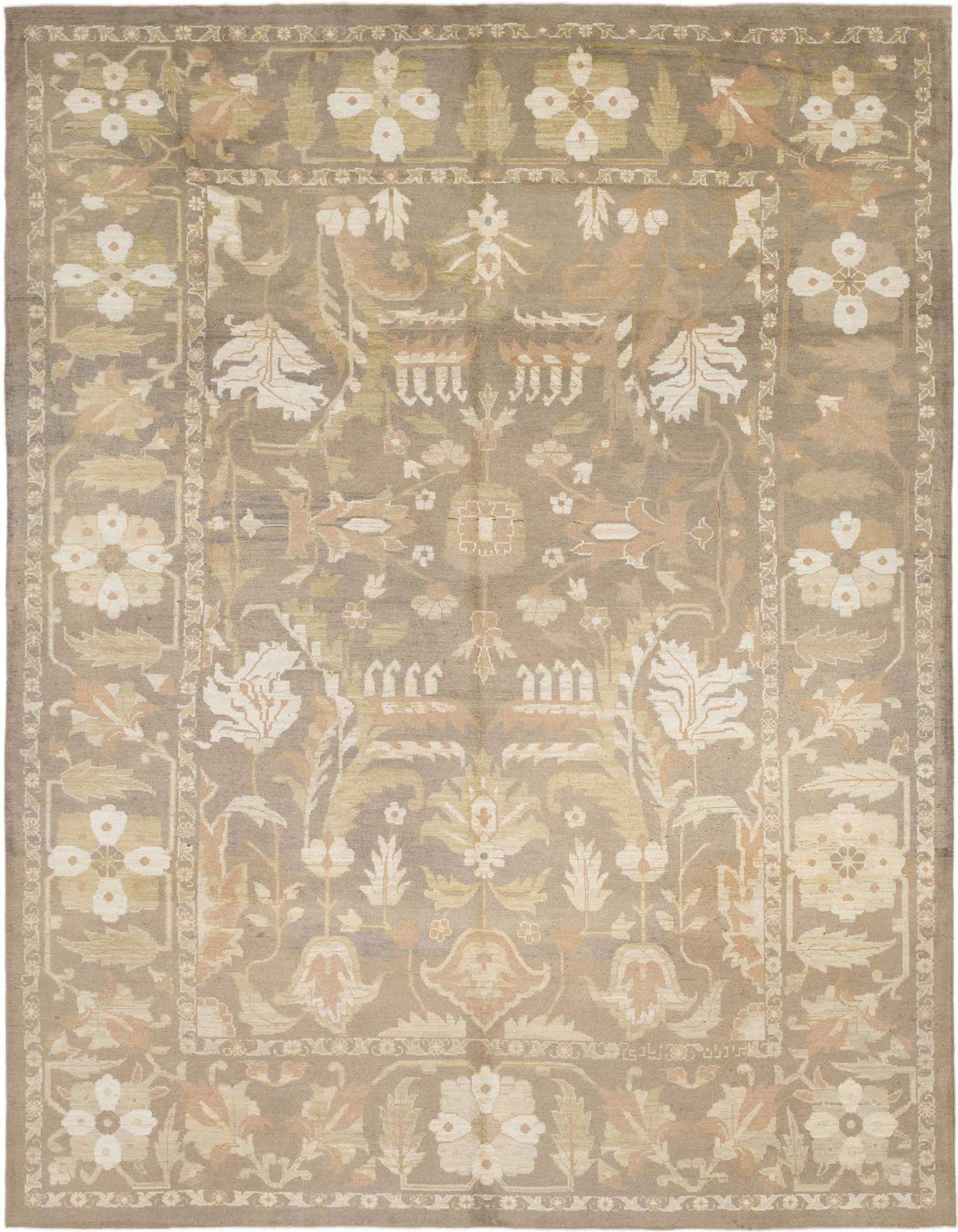Rectangular Oushak rug in shades of brown and tan, featuring a traditional floral and tribal pattern with a decorative border.