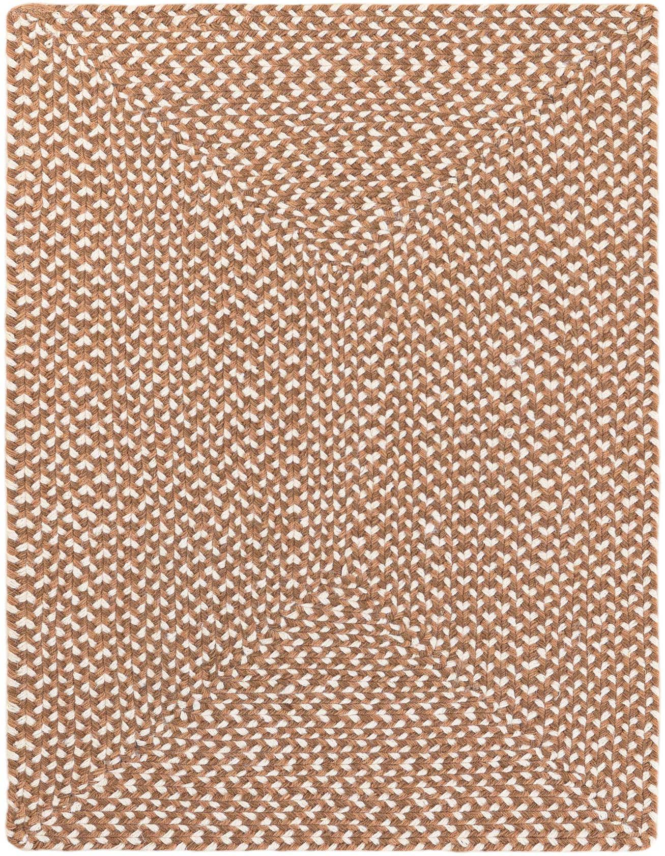 A 2x3 rectangular Rugs.com Tweed Braided Jute rug in varying shades of brown and tan, showcasing its handmade texture.