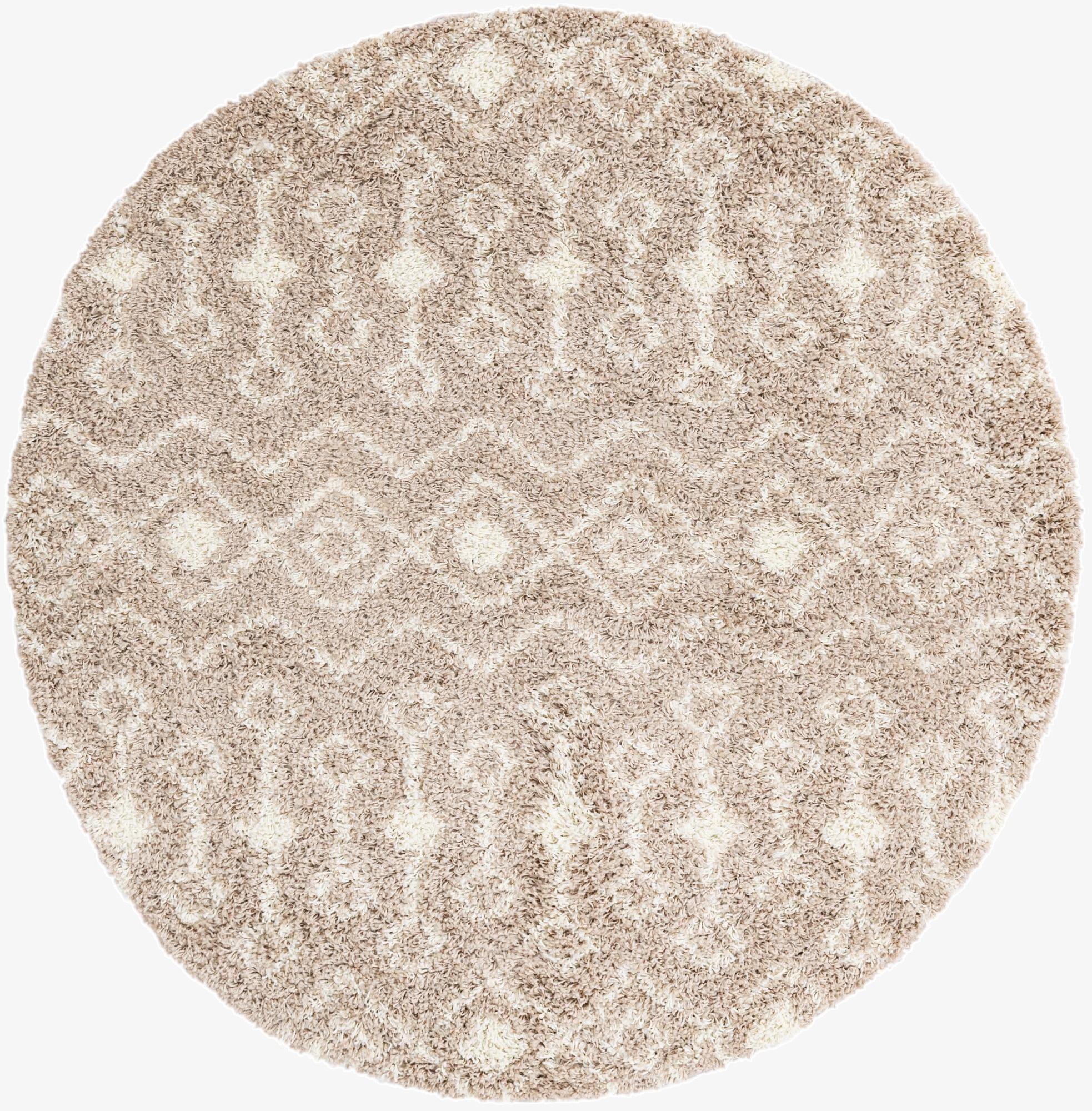 A 6' 0 x 6' 0 round shag rug in browns and tans with a modern tribal trellis pattern.