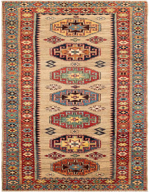 A 10 Ft Kazak runner rug with a tan background, featuring colorful geometric medallions and intricate floral borders, perfect for a hallway.