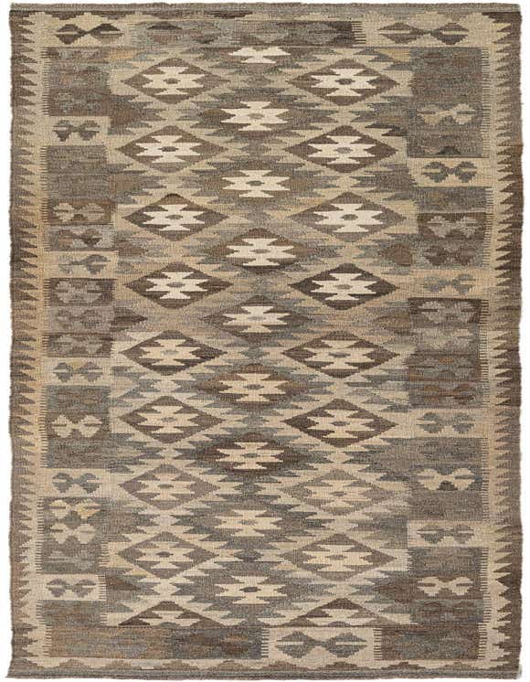 A 10 ft runner rug in browns and tans with a tribal geometric pattern, suitable for a hallway.