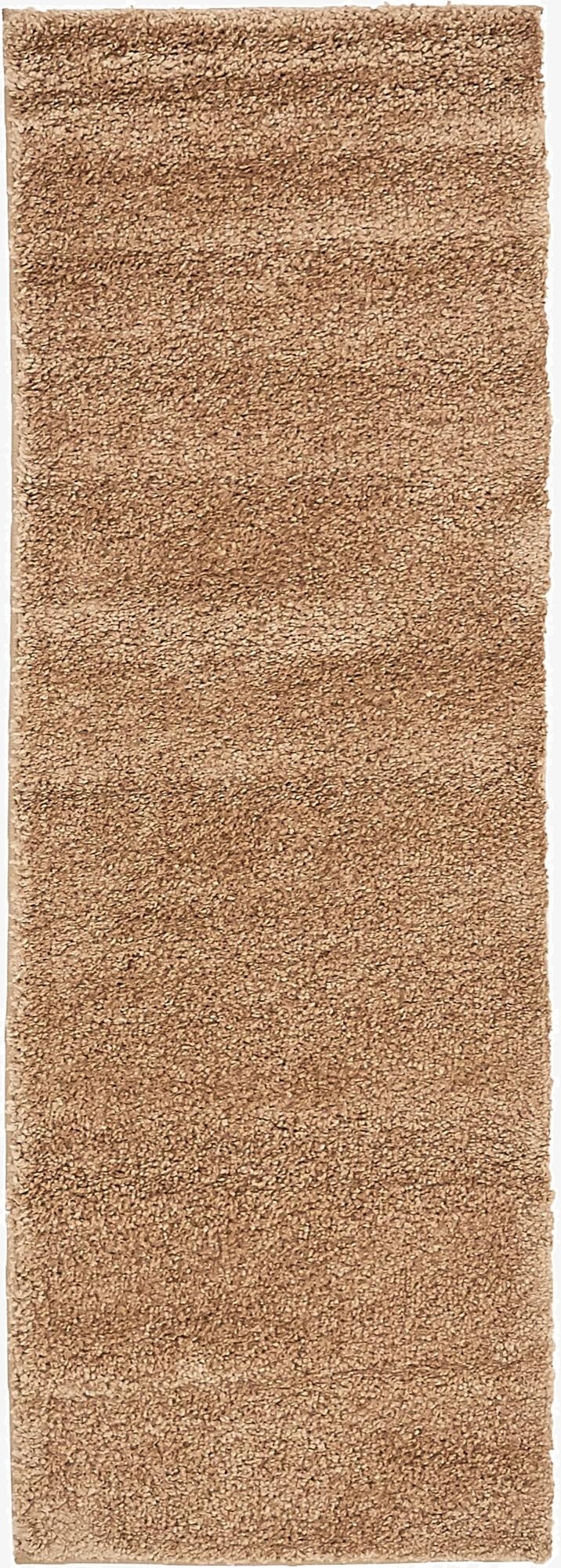 A 7 ft runner rug in a solid brown/tan color with a textured, frieze pile, ideal for hallways.
