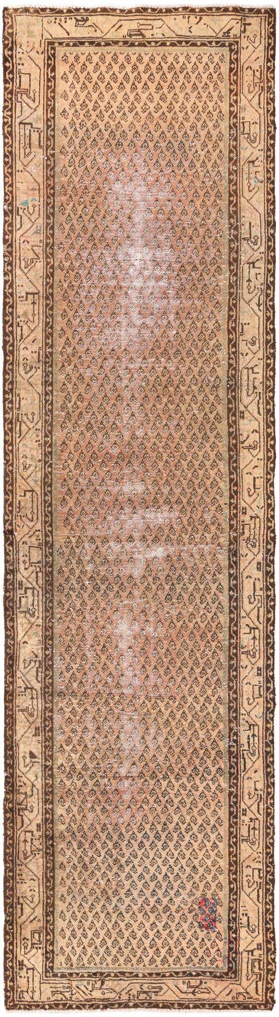 A 14 ft runner rug in shades of brown and tan, featuring a distressed Persian pattern with a repeating diamond motif and intricate border.