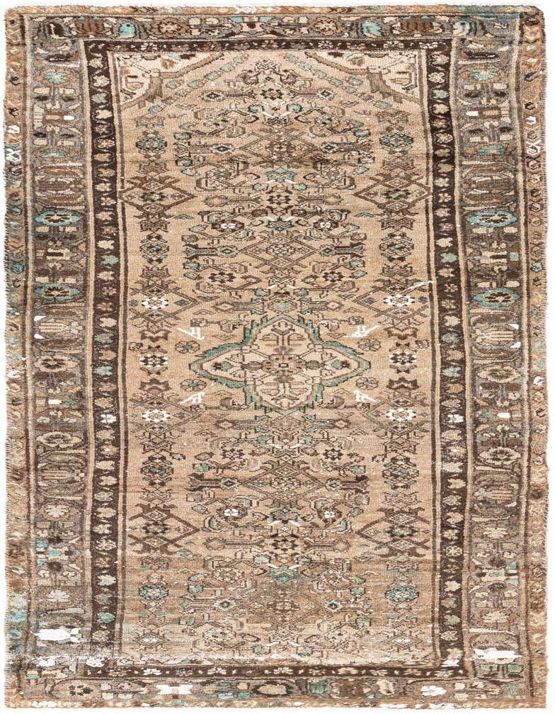 A 9 ft runner rug from the Ultra Vintage collection, featuring a distressed Persian medallion pattern in browns, tans, and hints of teal, ideal for a hallway.
