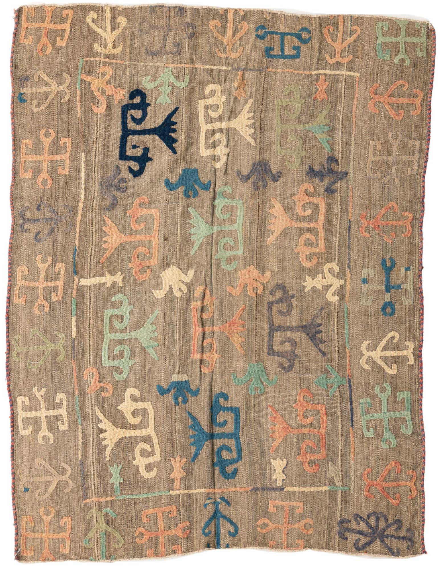 A 5'x5'10 square brown flatweave wool rug with colorful tribal and abstract motifs in blues, oranges, greens, and creams.
