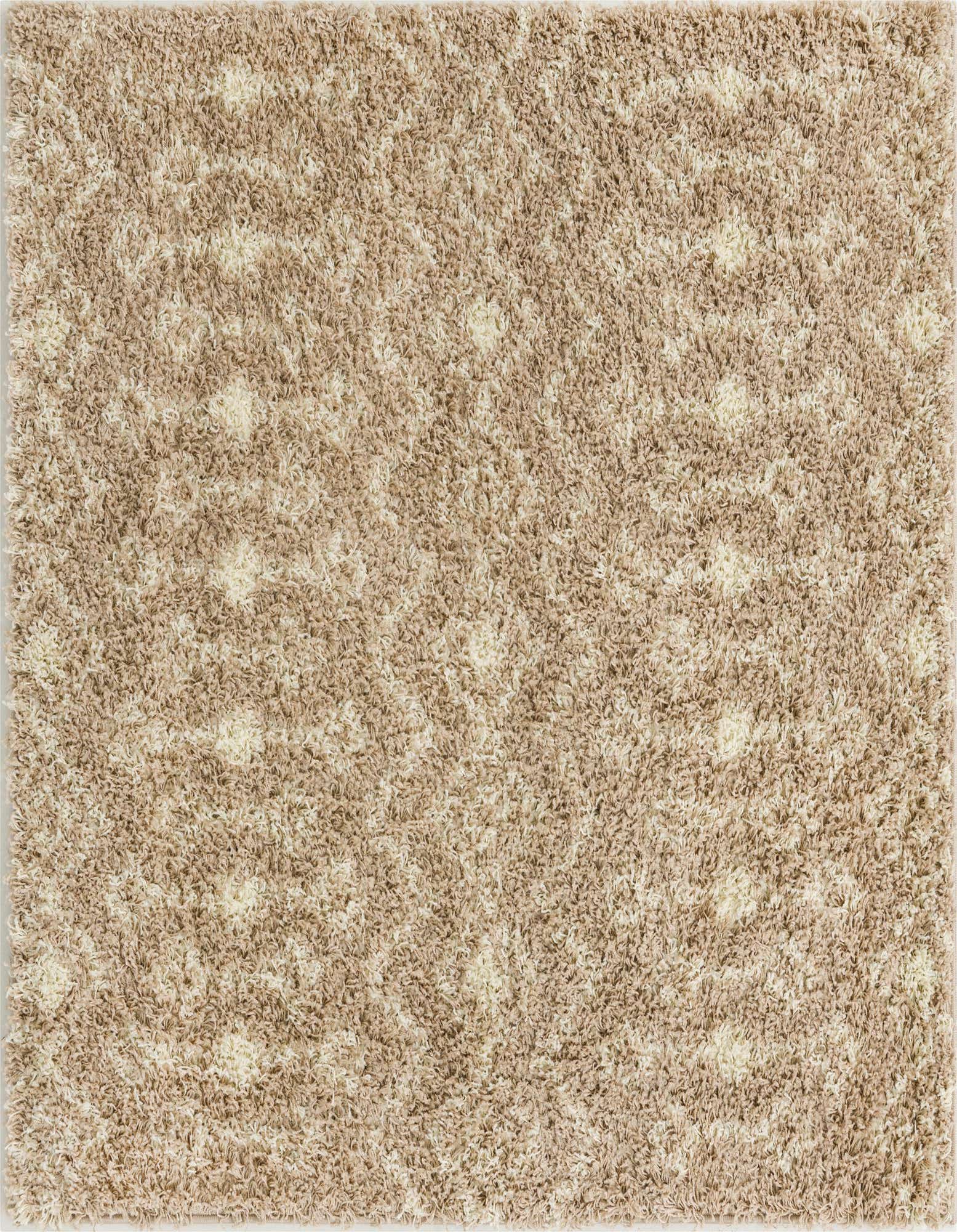 A 5' 3 x 5' 3 square shag rug with a modern tribal pattern in varying shades of brown and tan.