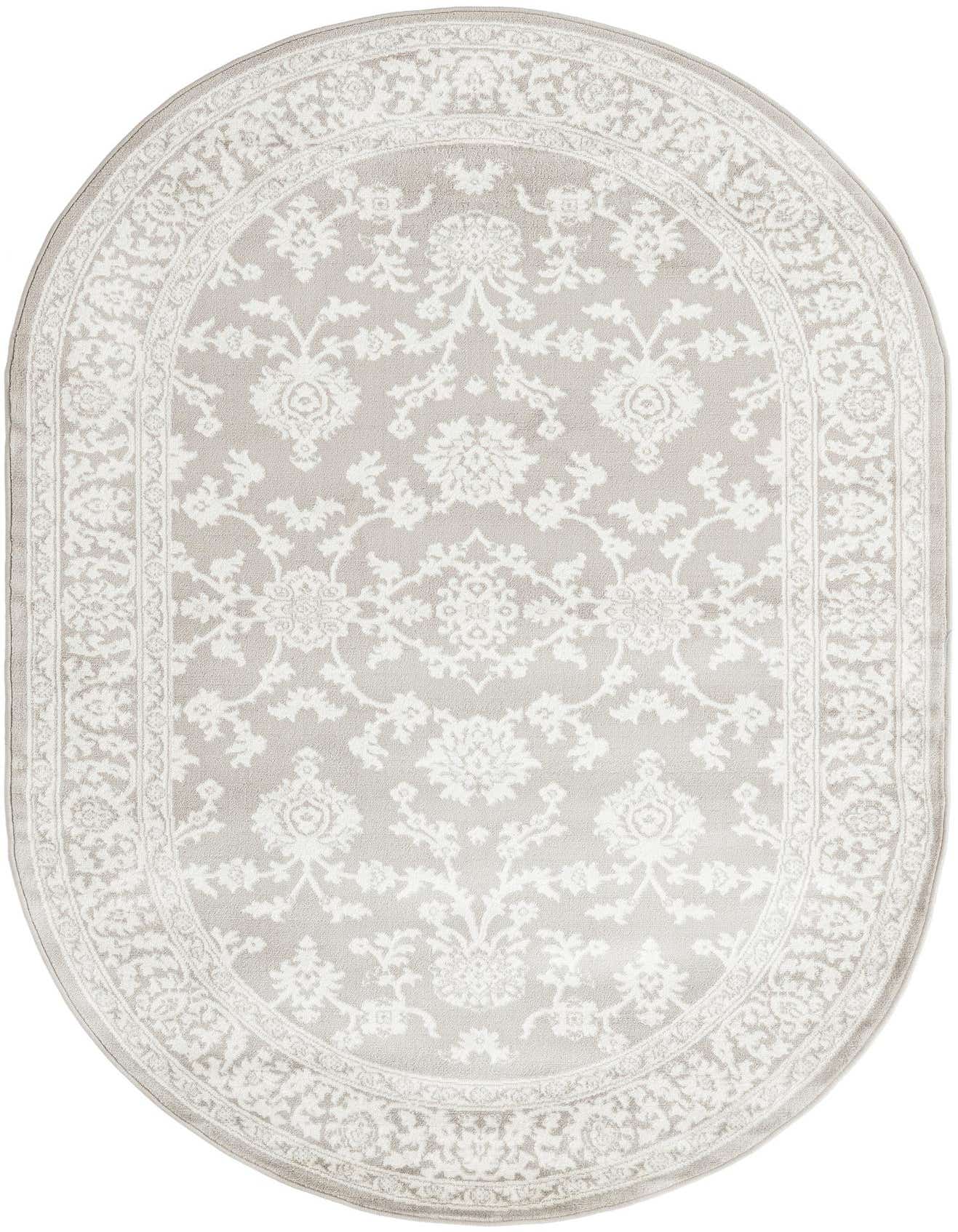 An oval 5'3" x 8'0" gray rug with an intricate white traditional floral and oriental pattern and border.