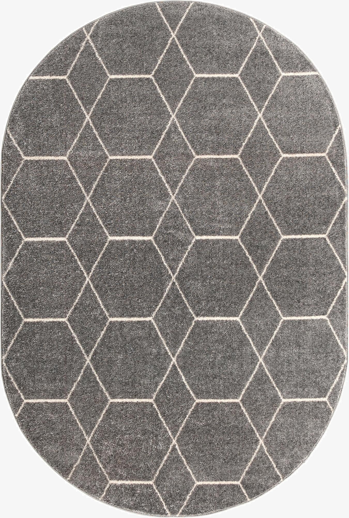 A 4'x6' oval gray modern rug with a white geometric trellis pattern, suitable for various indoor spaces.