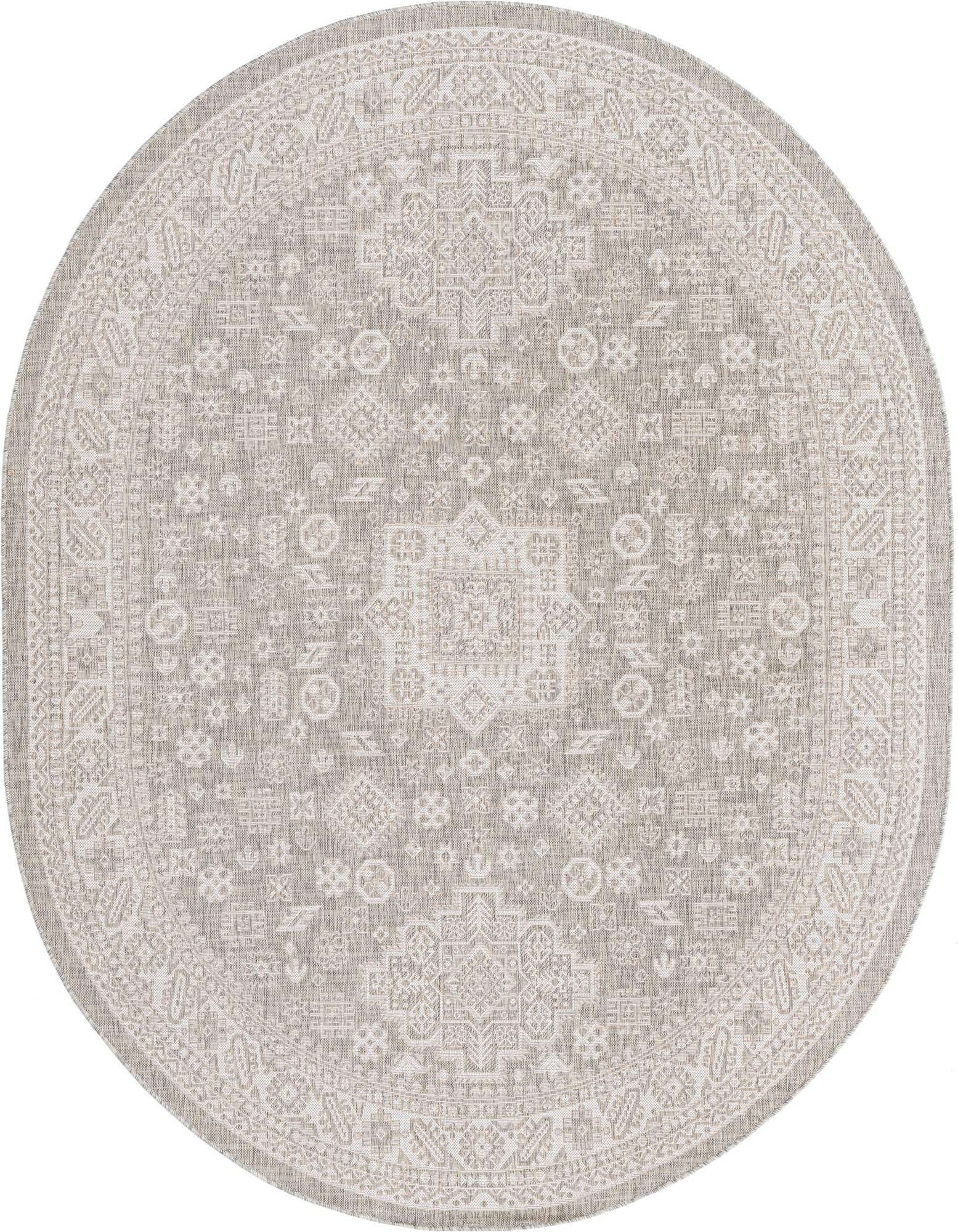 An oval 7' 10 x 10' 0 gray Southwestern rug with a detailed tribal pattern and border, suitable for indoor or outdoor use.