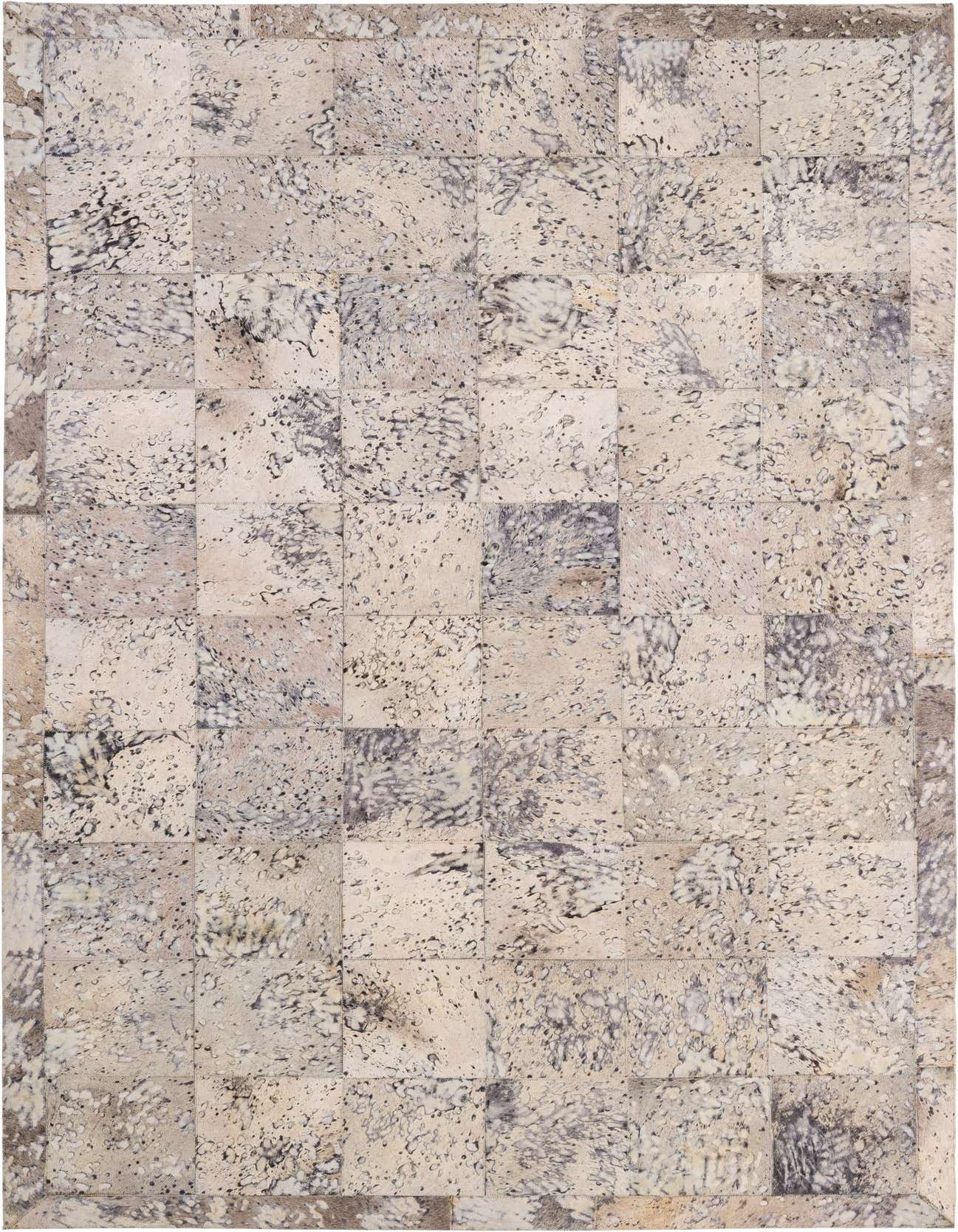 A 5x8 rectangular Cowhide Patchwork rug in grays and silvers, featuring a modern abstract pattern suitable for a living room.