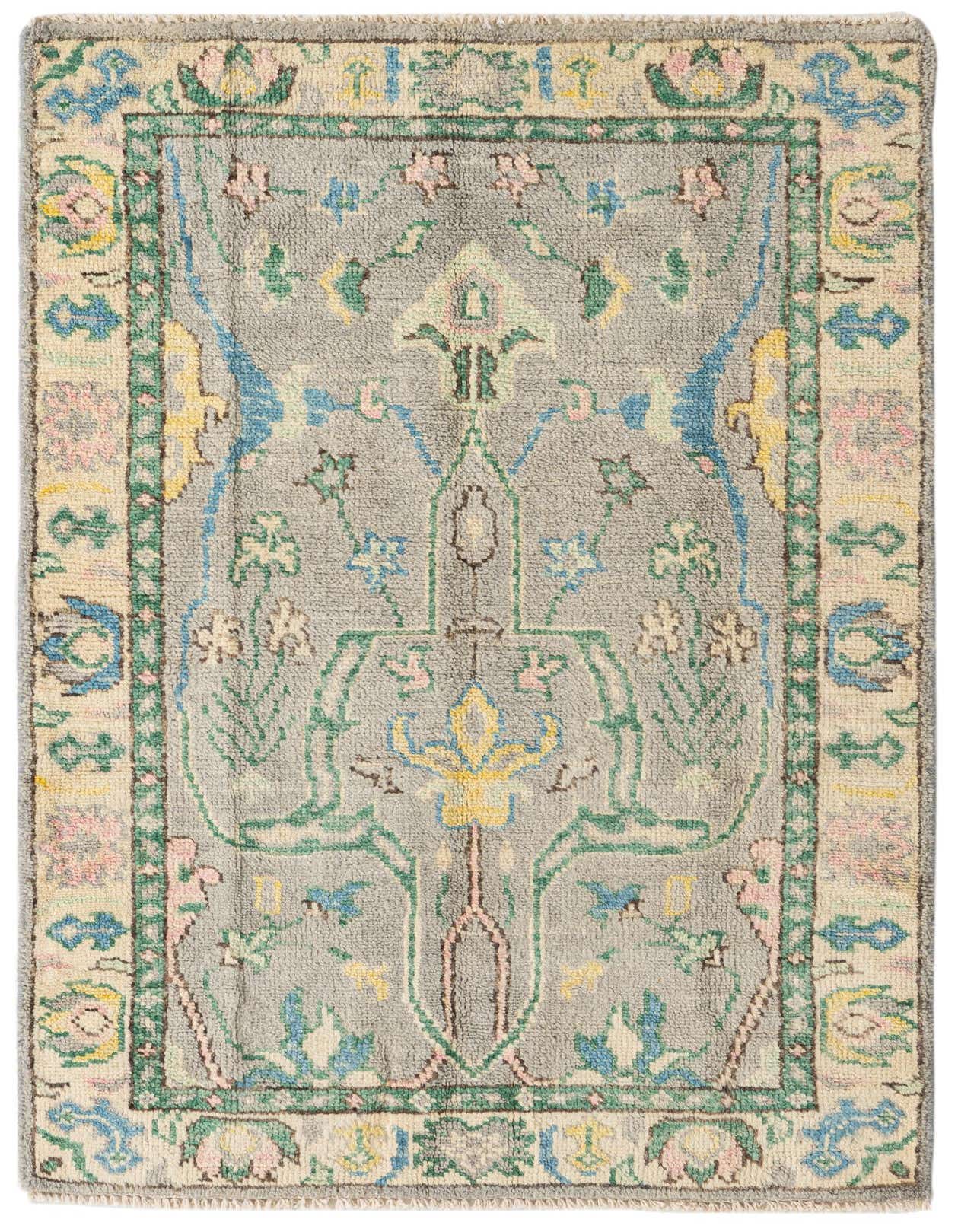 A 3x5 rectangular gray wool rug with a colorful modern floral and geometric pattern and a light border.