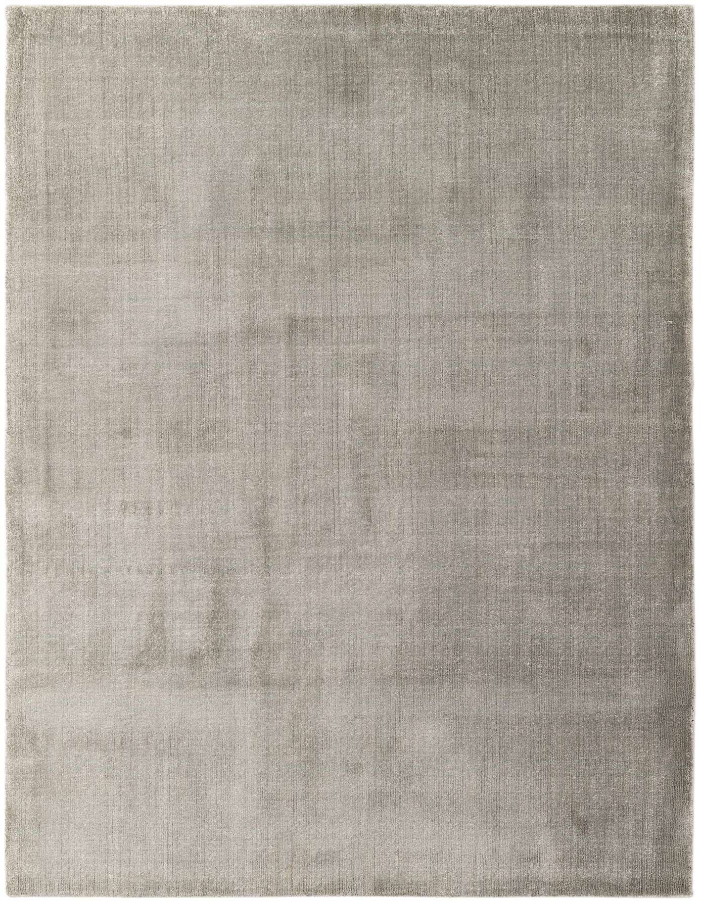 A 5x8 rectangular Luna Collection rug from Rugs.com, featuring a solid modern gray design with a high pile, suitable for a living room or bedroom.