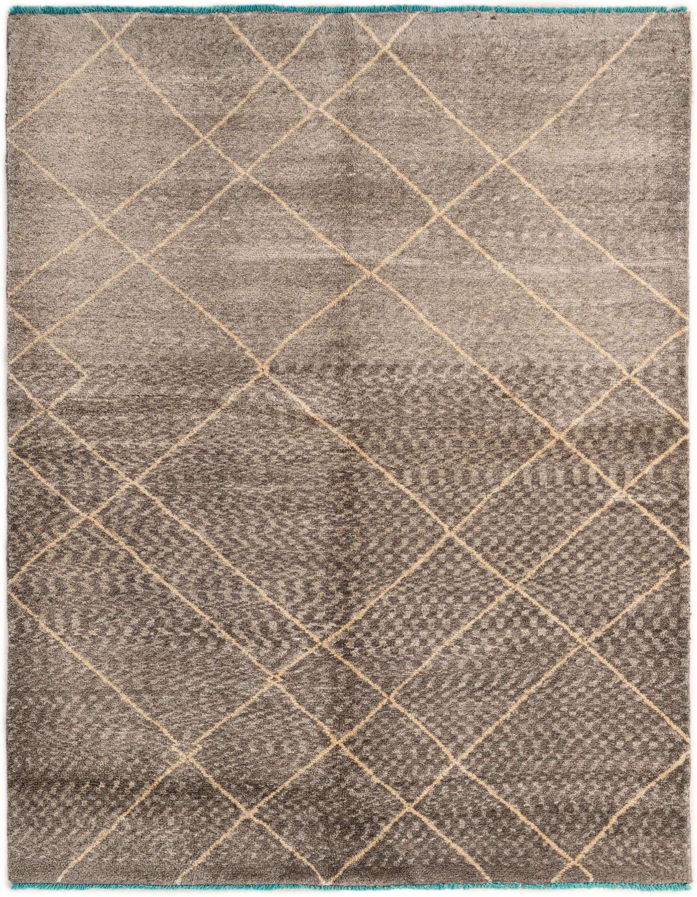 A 5x8 rectangular gray wool area rug featuring a modern tribal diamond pattern in lighter gray, with a subtle blue fringe.