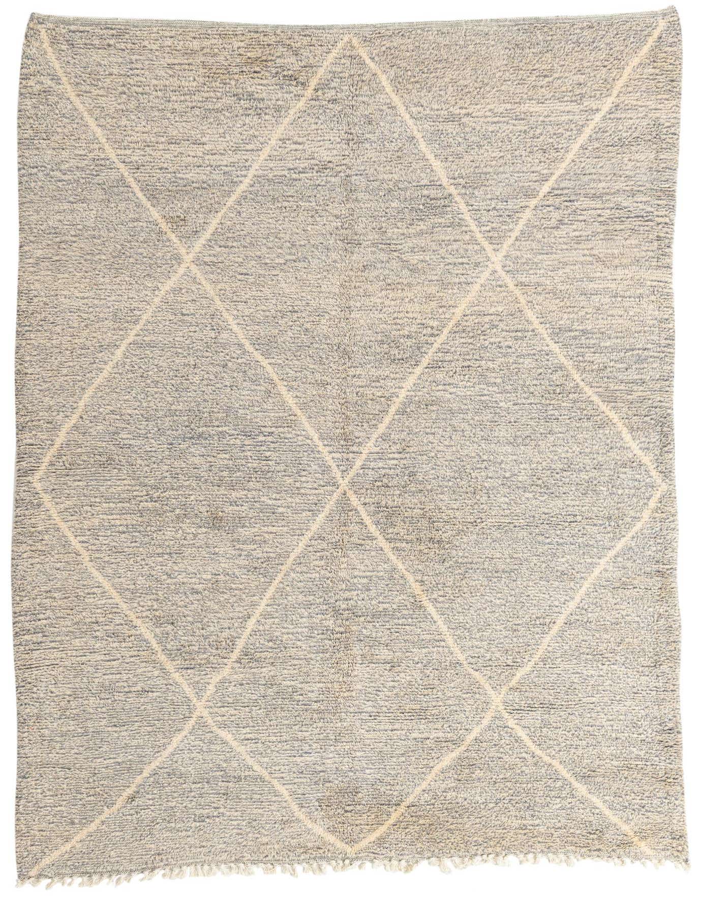 A 7x10 rectangular gray shag rug with a cream tribal diamond pattern and fringed edges, suitable for a living room.
