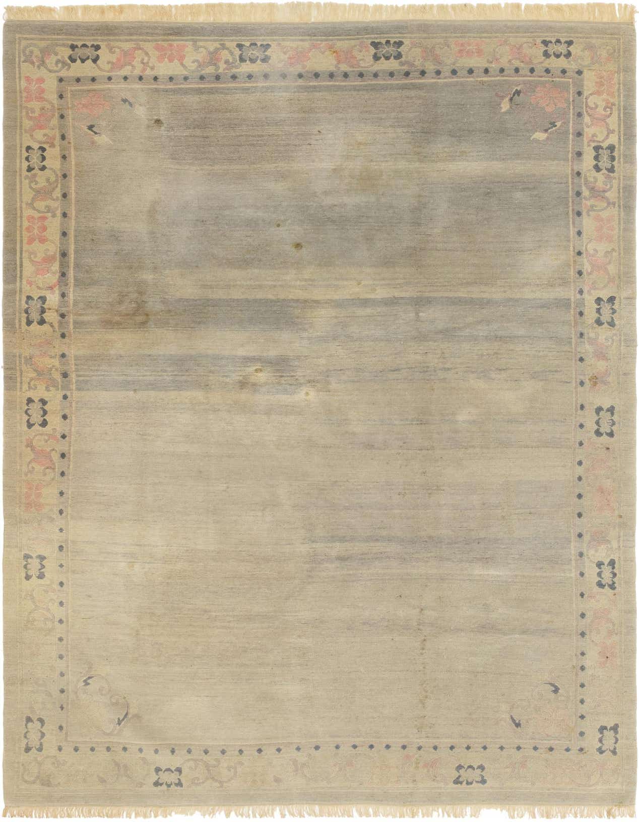 A 7x10 rectangular gray wool rug with a subtle traditional border in muted pinks and grays, suitable for a living room.