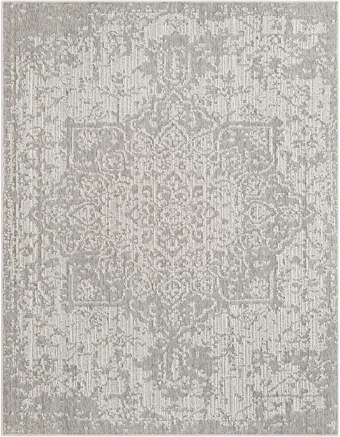 A 6x9 rectangular gray and silver indoor/outdoor rug with a distressed traditional medallion pattern, ideal for a patio or living room.