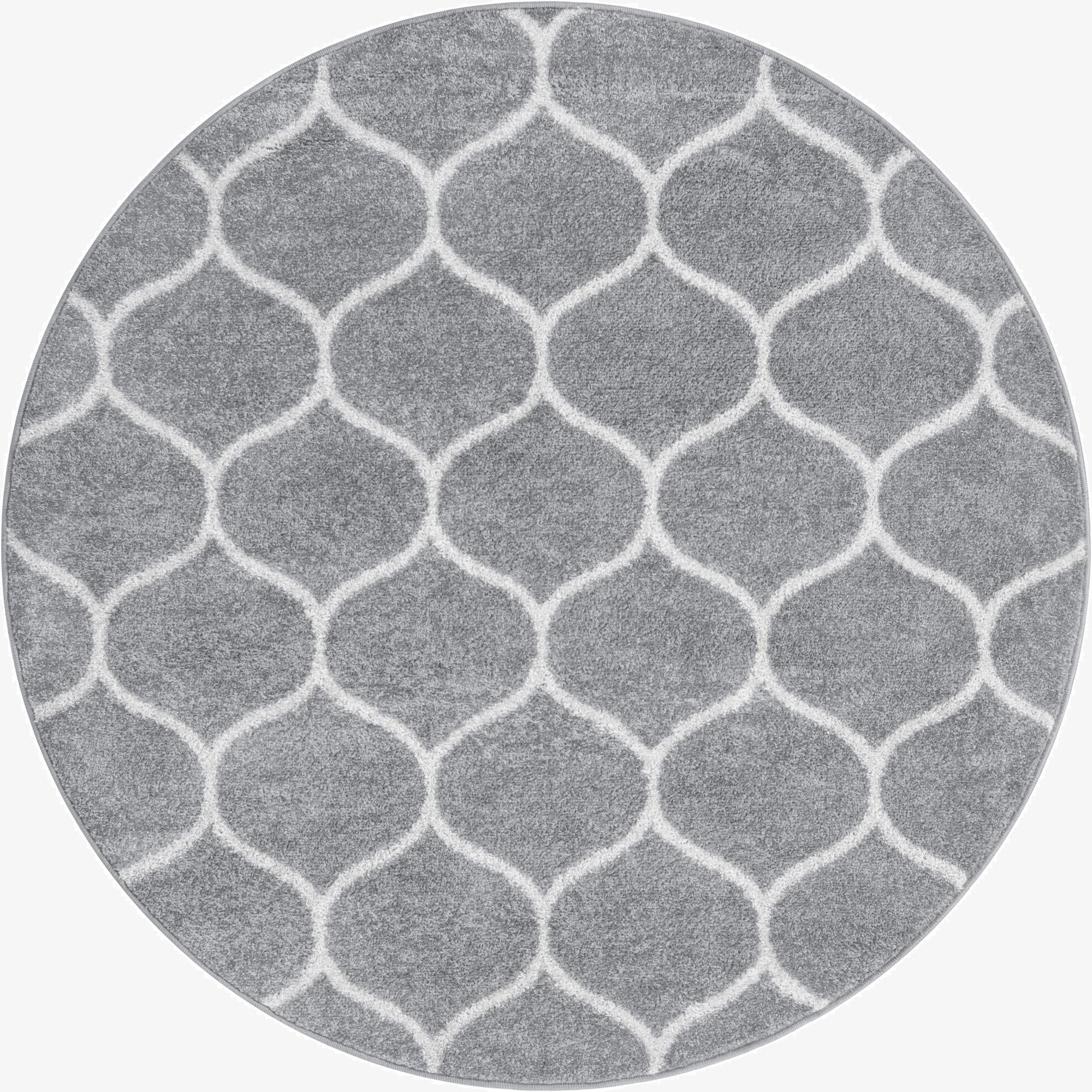 A 5' 3 round gray area rug with a modern white trellis pattern, suitable for various indoor spaces.