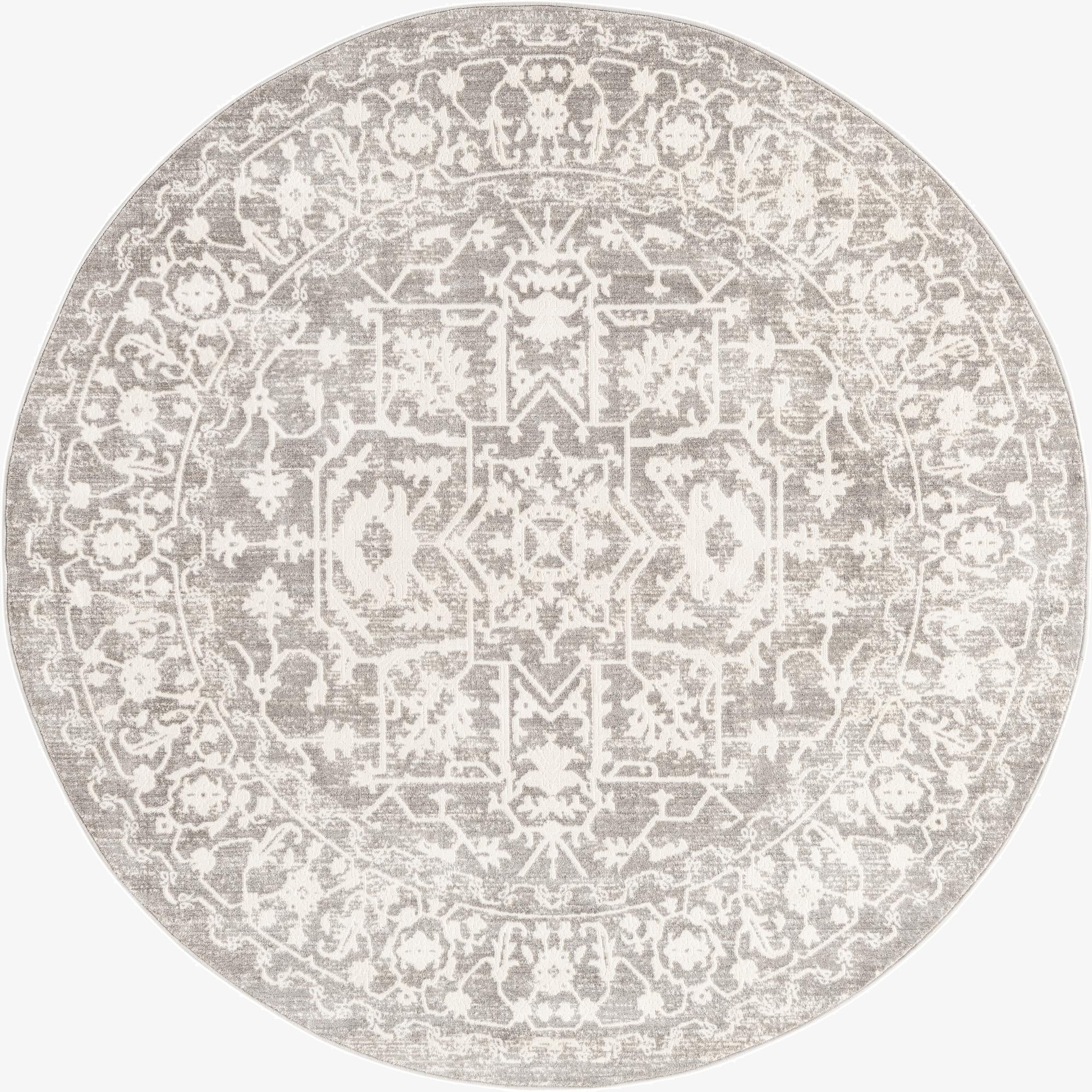 A 6' 0 round gray and silver rug with a distressed medallion and botanical pattern, perfect for an indoor living space.