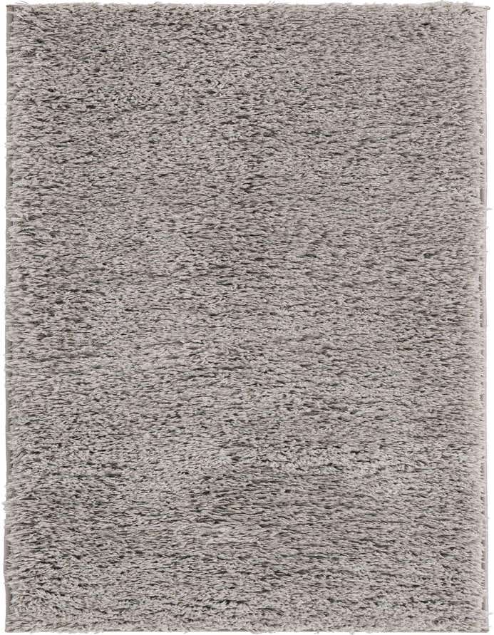 A soft, plush gray shag runner rug, perfect for adding comfort and modern style to a hallway.