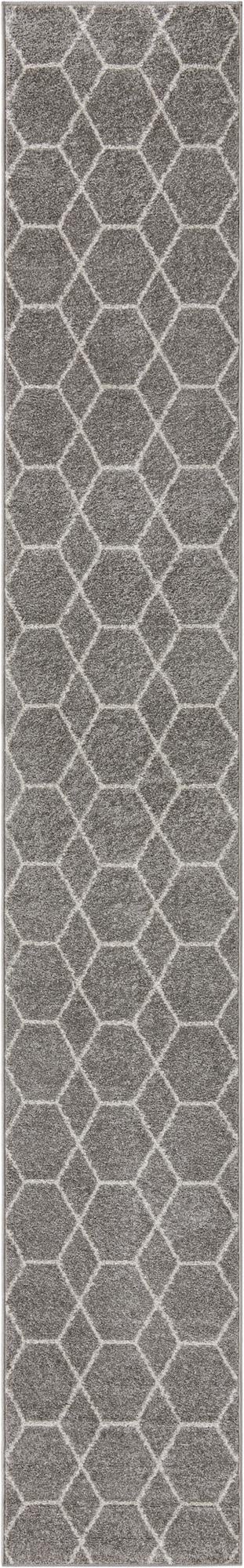 A long, thin gray runner rug with a white modern trellis pattern, ideal for a hallway.