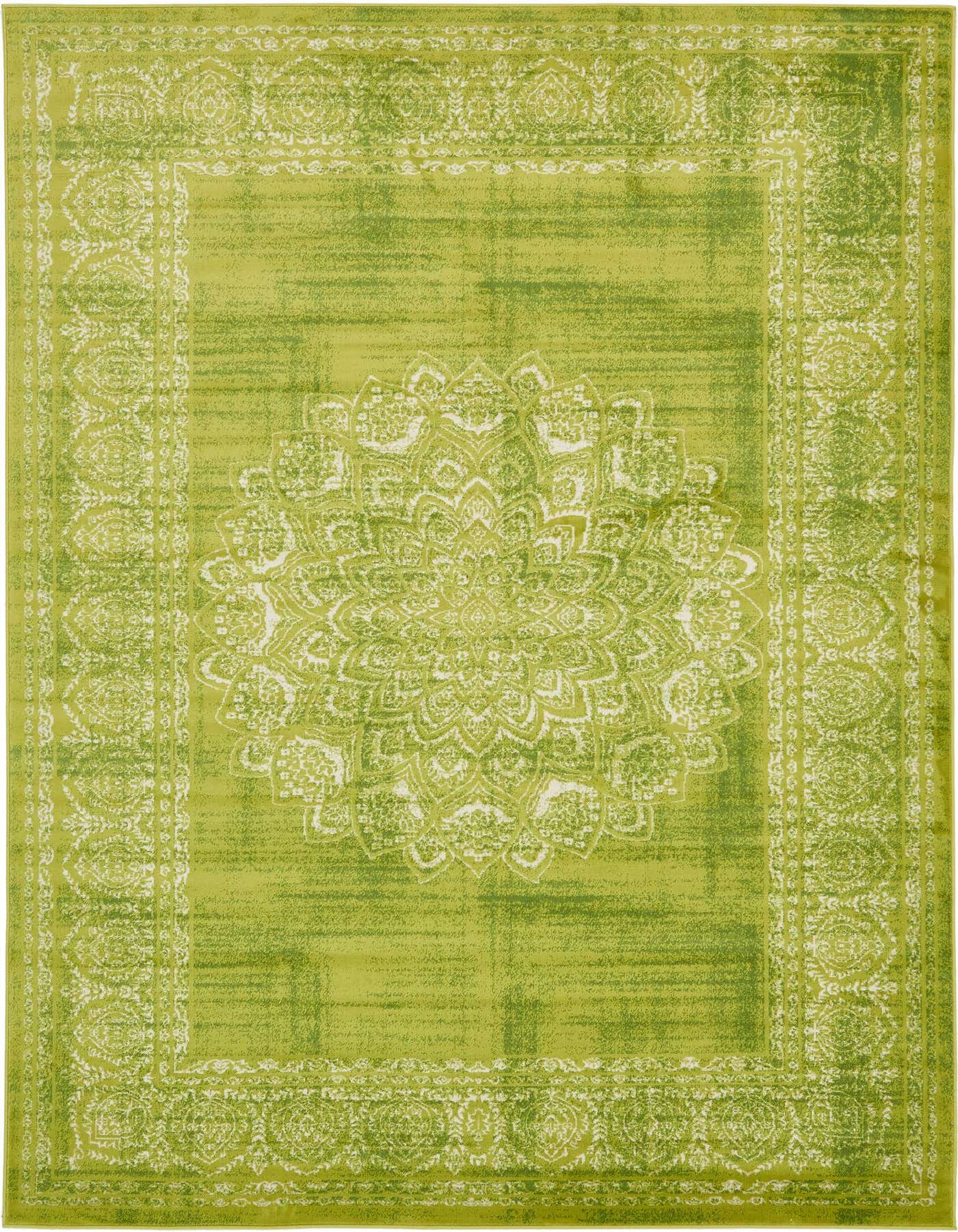 A 7x10 rectangular green area rug with a faded white medallion pattern and border, suitable for a living room.