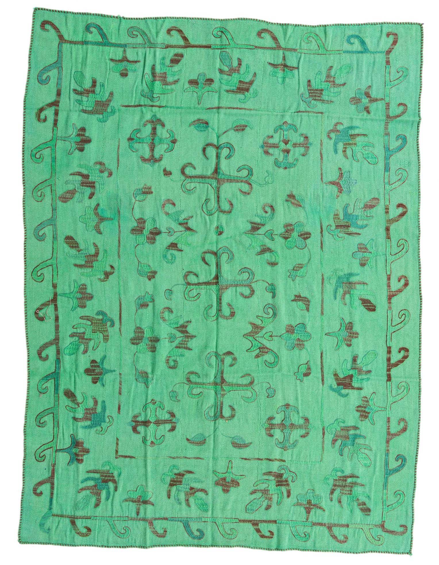 A 5x8 rectangular Kilim Suzani rug in varying shades of green with an abstract tribal pattern, handmade from wool.