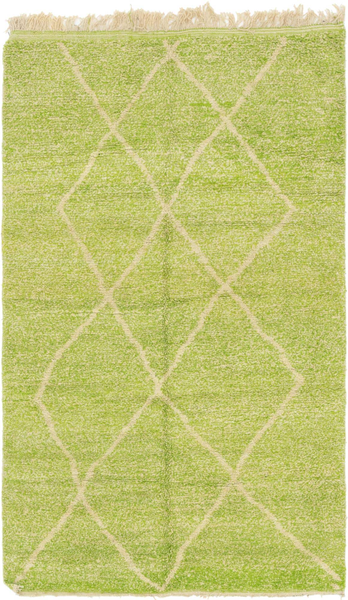 A 5x8 rectangular shag rug in bright green with a cream diamond trellis pattern and fringed ends.