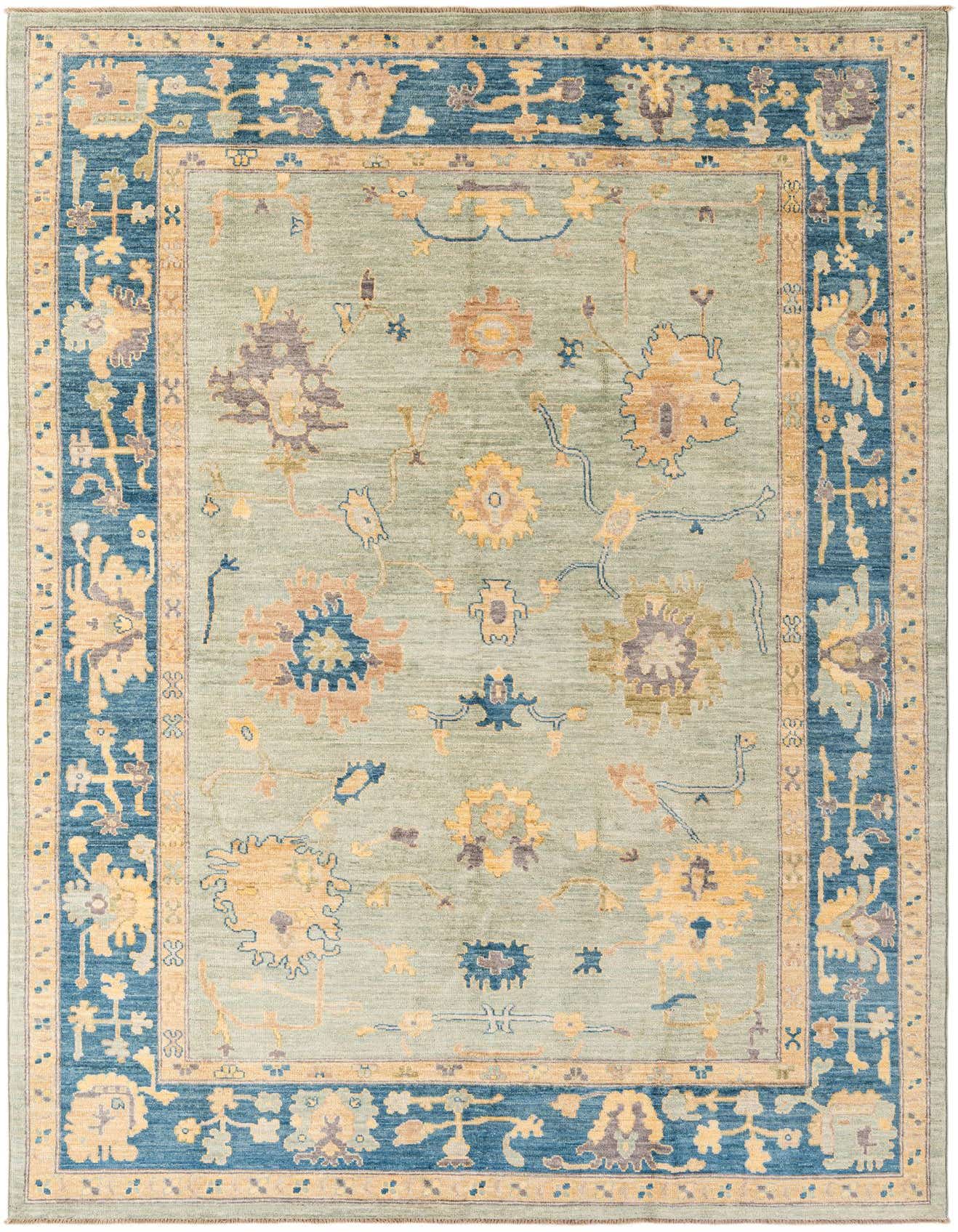 A 7x10 rectangular Oushak rug with a sage green field and a wide navy blue border, featuring traditional floral and vine patterns in gold, rust, and purple.