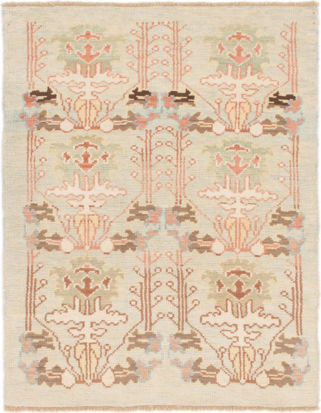 A 4x6 rectangular Oushak rug with a tribal abstract pattern in greens, pinks, and browns on a light background.