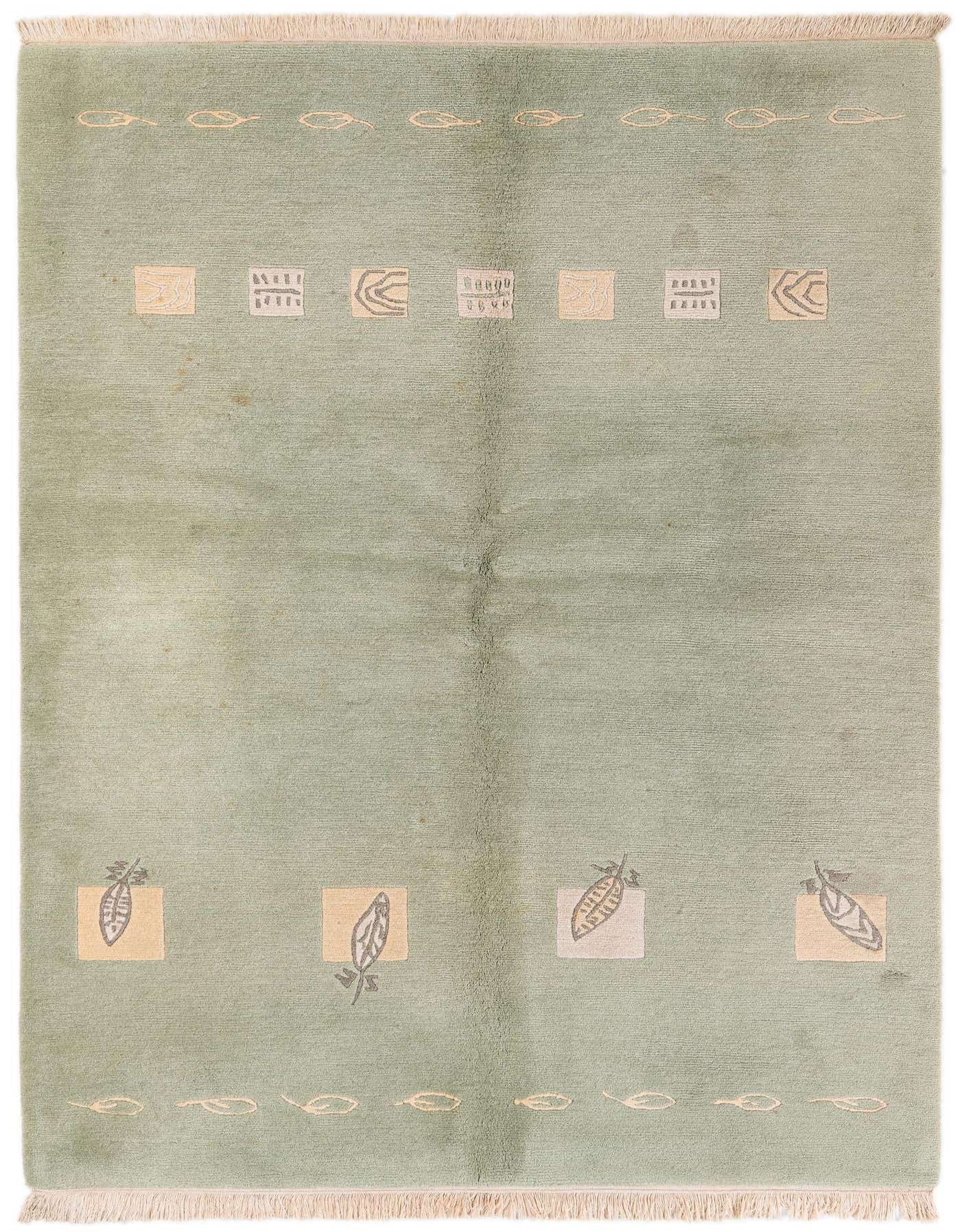 A 5x8 rectangular green wool rug featuring a modern abstract pattern with light squares and leaf-like motifs.