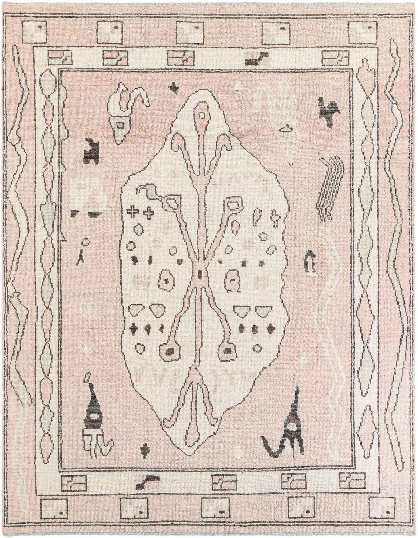 A 9x12 rectangular pink shag rug with a large off-white medallion and tribal motifs, perfect for a living room.