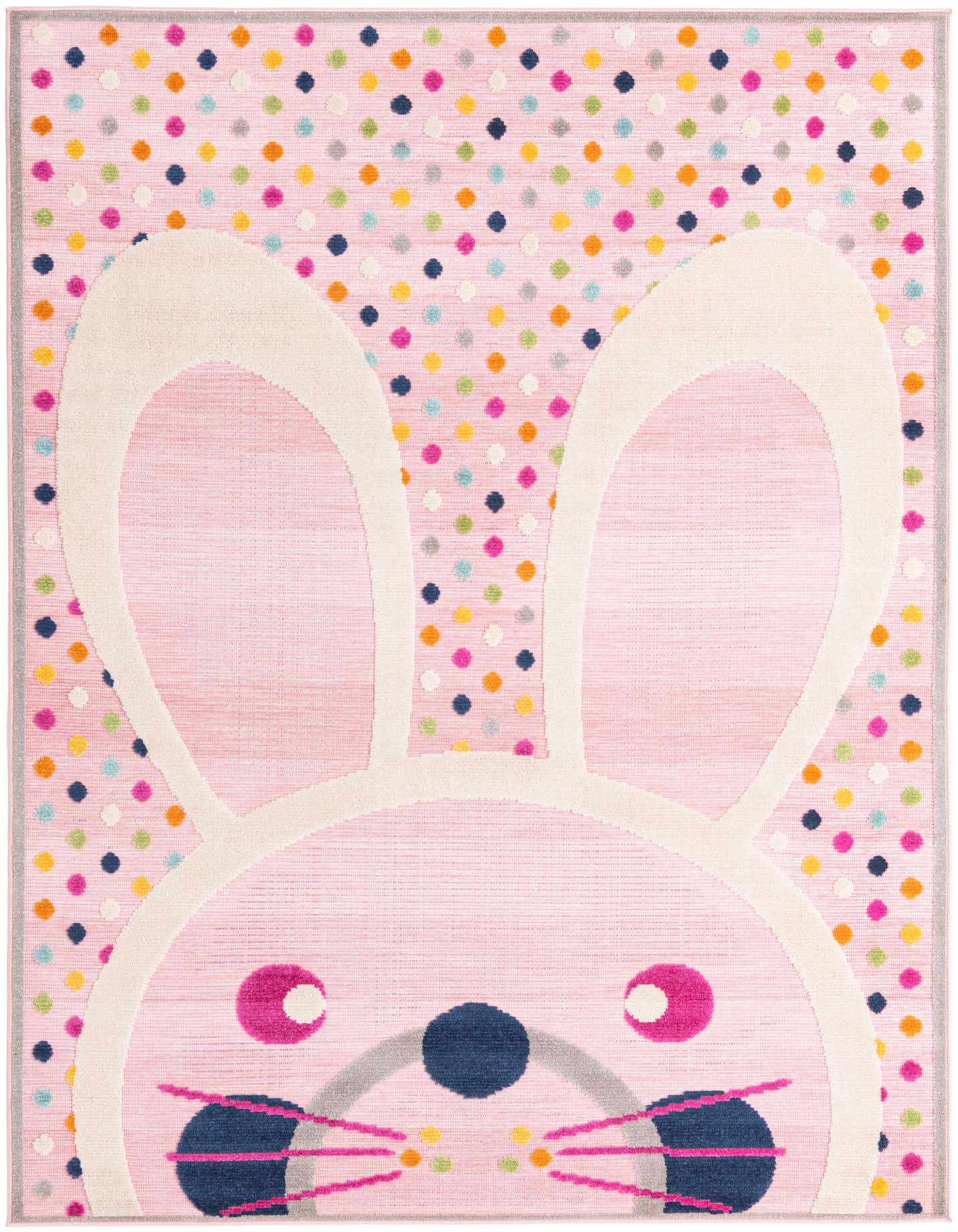 A 5x8 rectangular pink rug featuring a large, playful bunny face with white ears, blue nose, and pink whiskers, set against a background of colorful polka dots.
