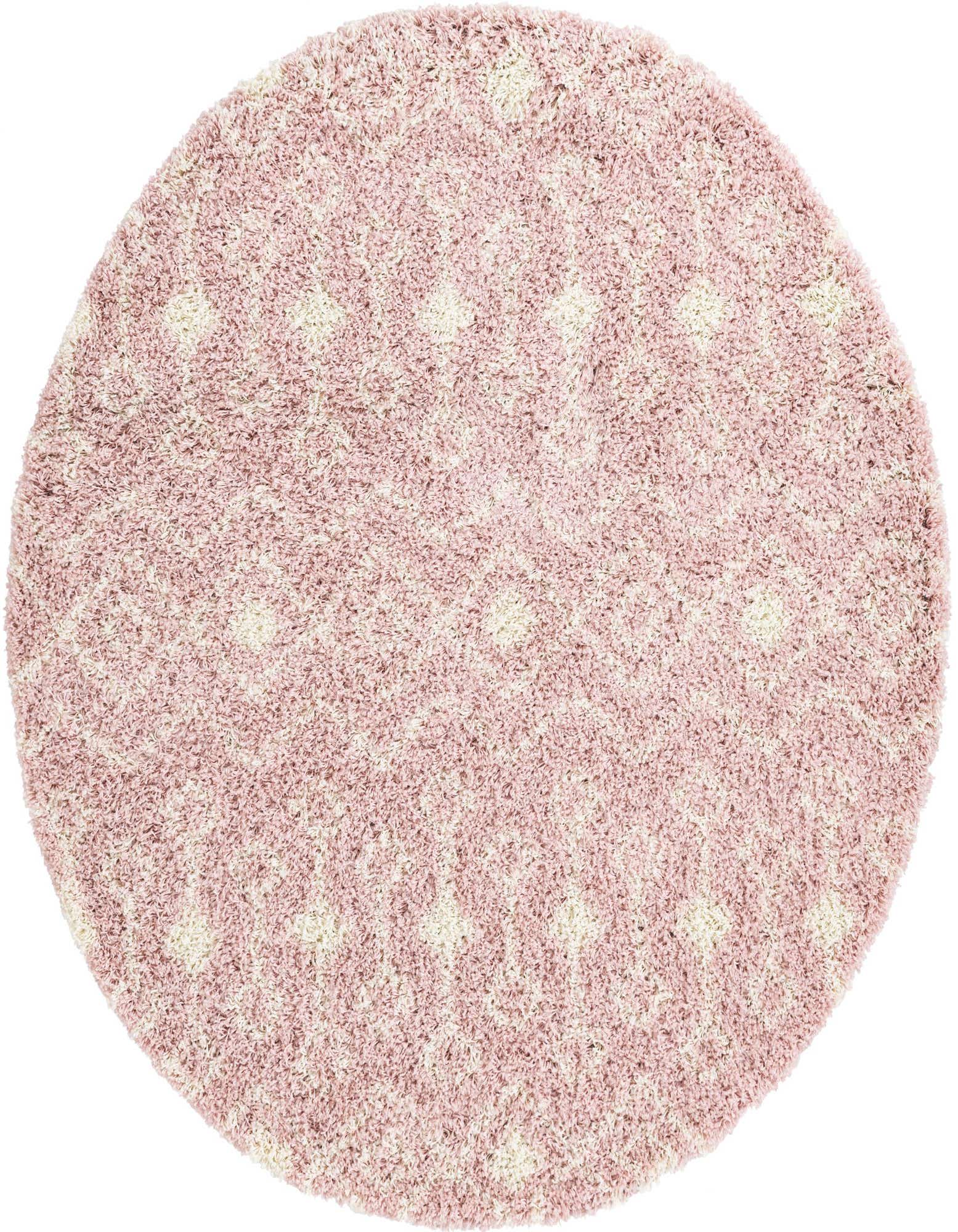 A round, plush pink shag rug with a subtle cream tribal pattern, perfect for adding warmth to any indoor space.