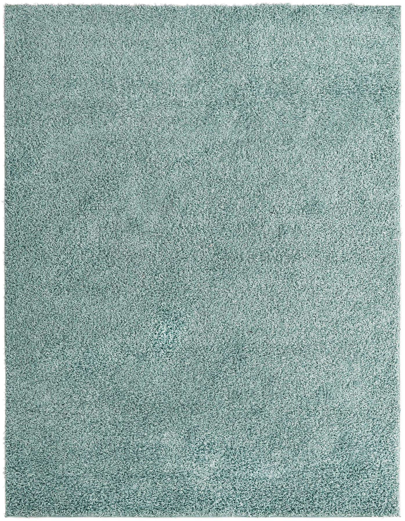 A soft, rectangular 7x10 shag area rug in a solid light blue color, perfect for a modern living room.